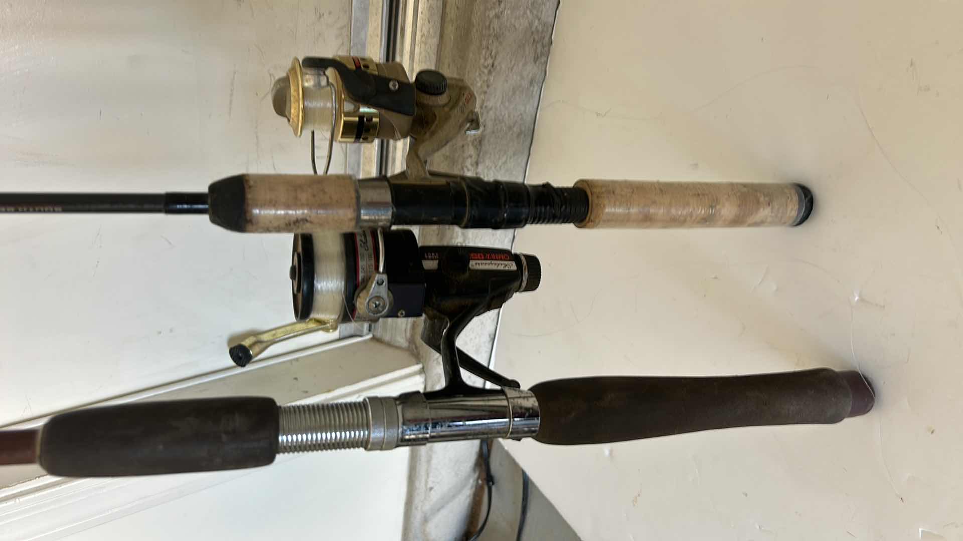 Photo 2 of TWO FISHING RODS AND REELS