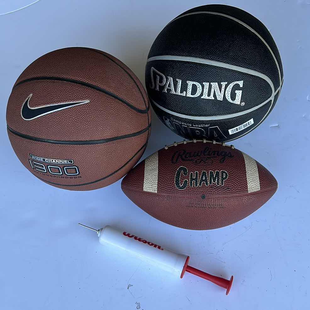 Photo 1 of TWO BASKETBALLS, ONE FOOTBALL, AND A PUMP.