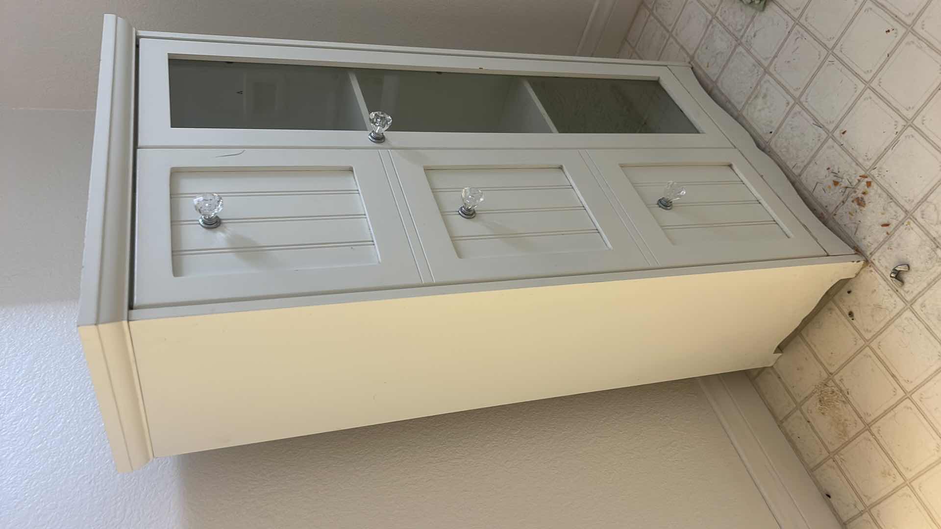 Photo 2 of SMALL WHITE CABINET 19” x 9 1/2” x H34 1/2”