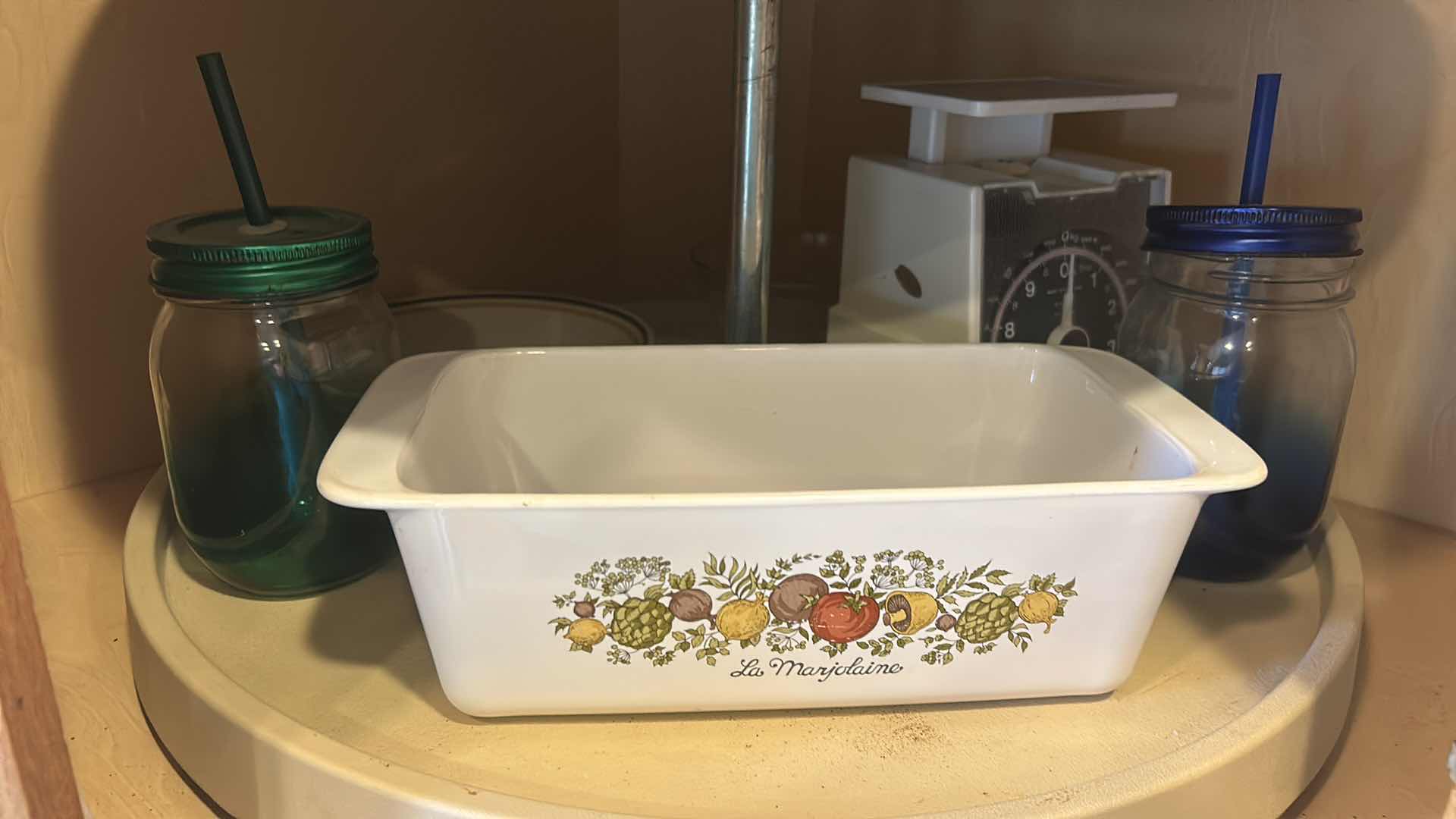 Photo 1 of CONTENTS OF CORNER CABINET IN KITCHEN- CORNING WARE, FOOD SCALE & MORE