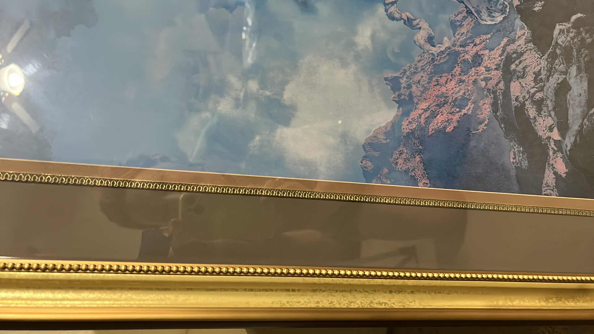 Photo 1 of GOLD FRAMED, YOUNG WOMAN ON JAGGED ROCKS LOOKING UP AT SKY ARTWORK 24 1/2” x H30 1/2”