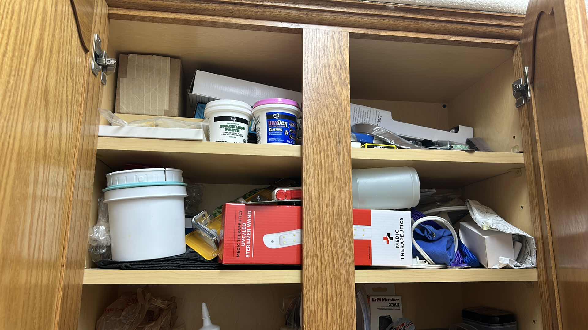 Photo 1 of CONTENTS OF CABINET LAUNDRY