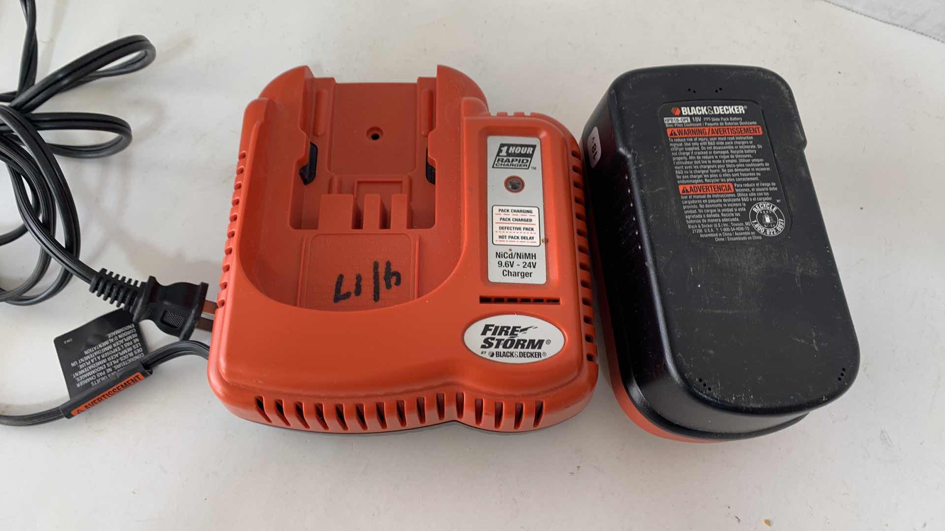 Photo 1 of BLACK AND DECKER 18V BATTERY AND CHARGER