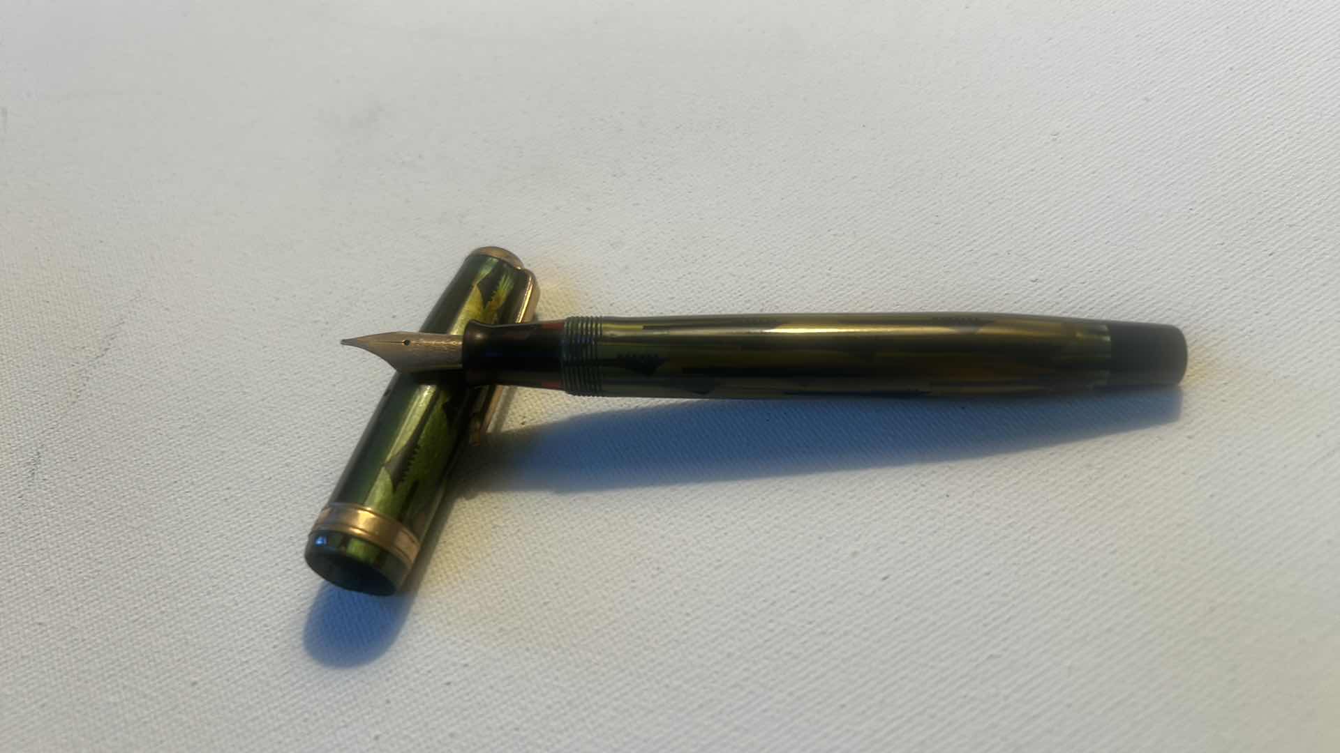Photo 1 of PARKER PARKETTE FOUNTAIL PEN IN GREEN AND BLACK MARBLED FINISH.