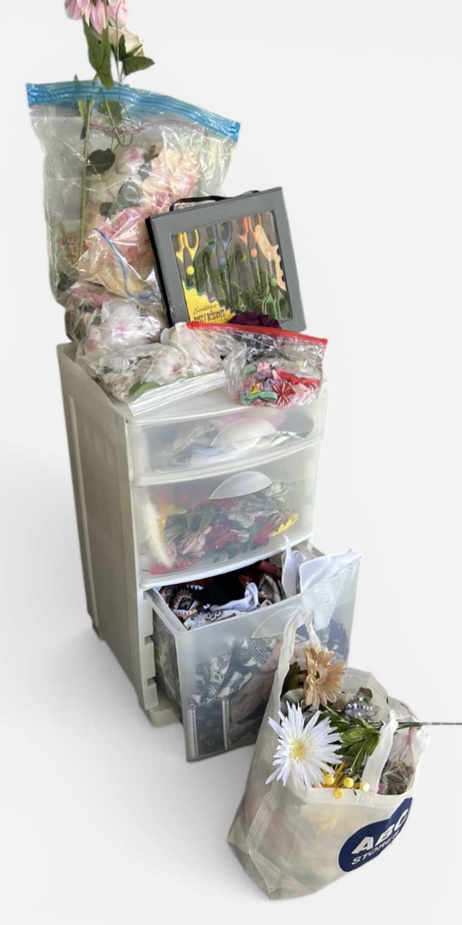 Photo 1 of ROLLED STORAGE WITH CRAFTING SUPPLIES, FAUX FLOWERS AND FABRIC