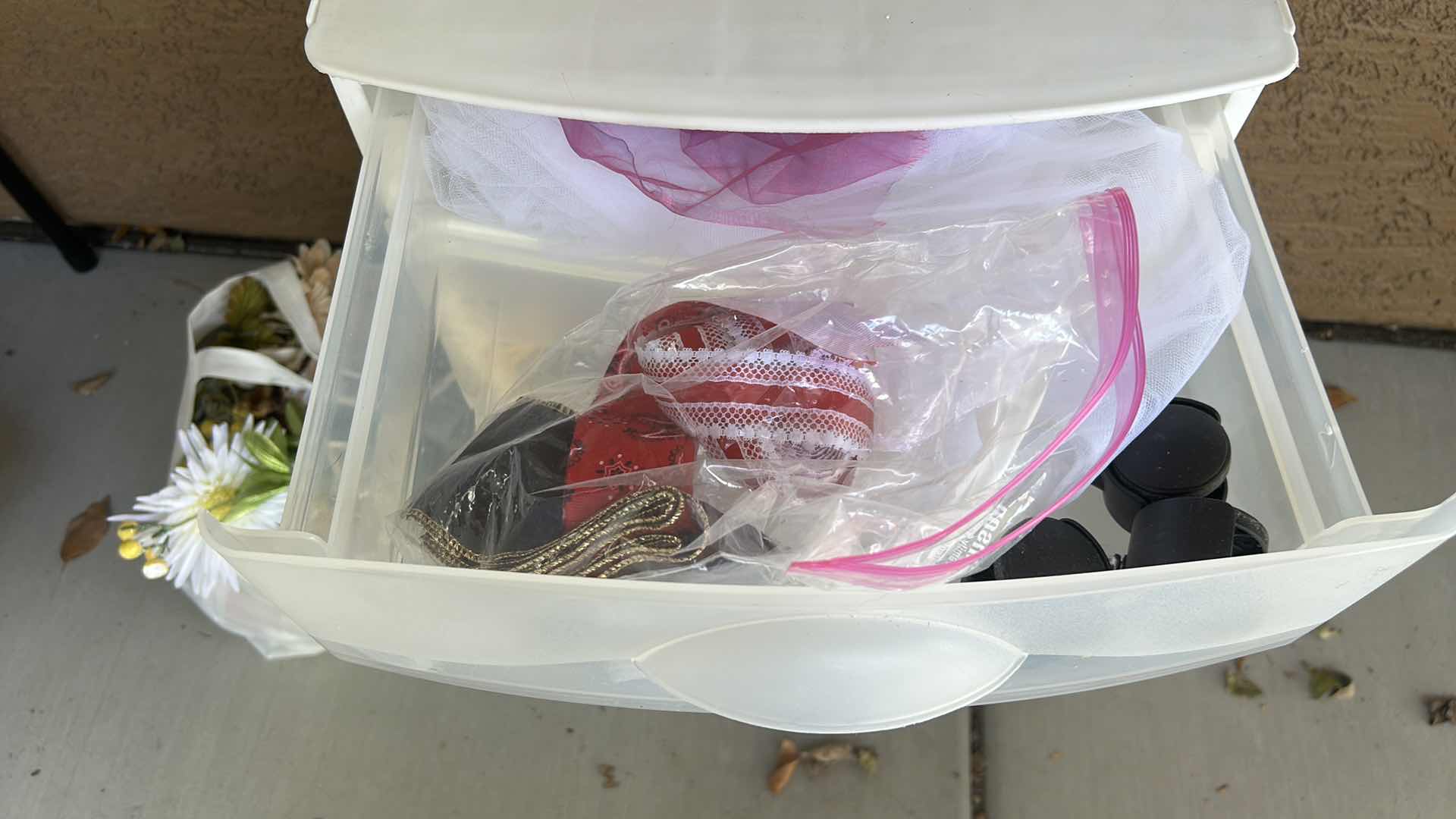 Photo 1 of ROLLED STORAGE WITH CRAFTING SUPPLIES, FAUX FLOWERS AND FABRIC