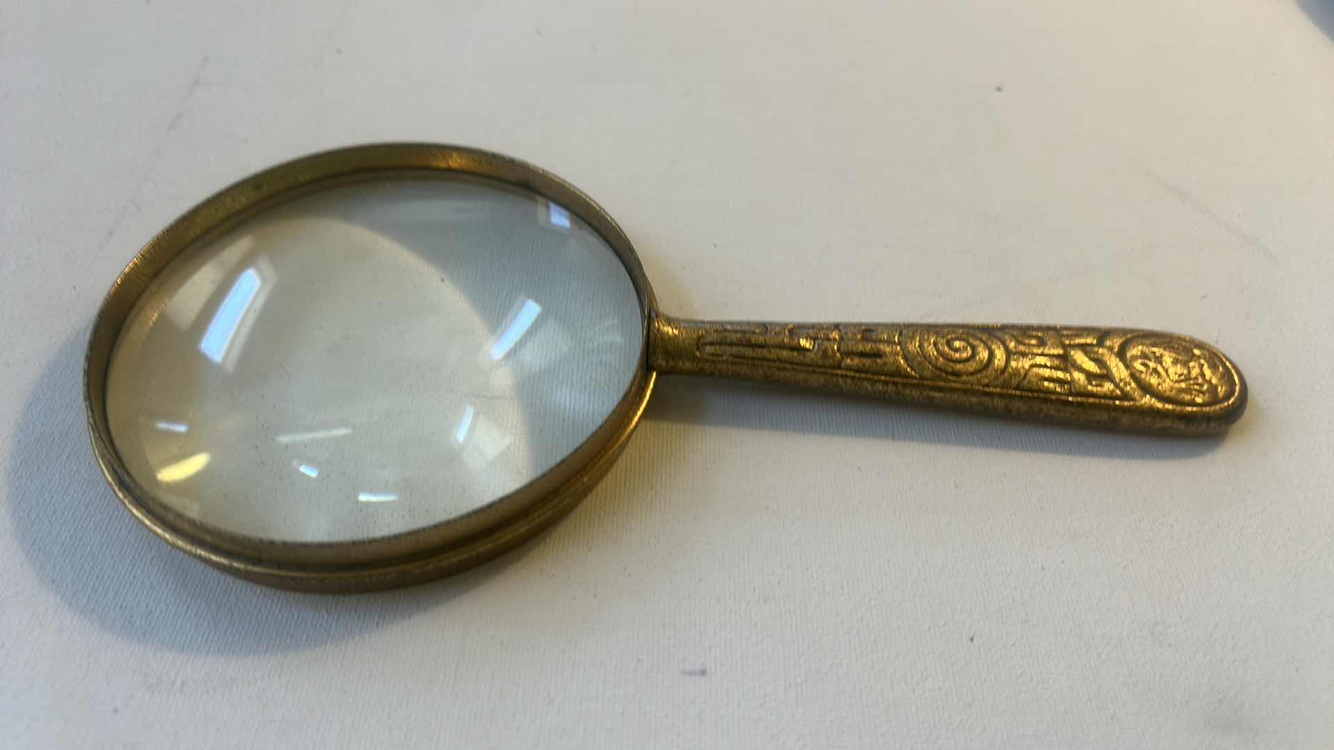 Photo 1 of TIFFANY  STUDIOS ZODIAC MAGNIFYING GLASS, A RARE ANTIQUE ITEM FROM THE 20TH CENTURY.