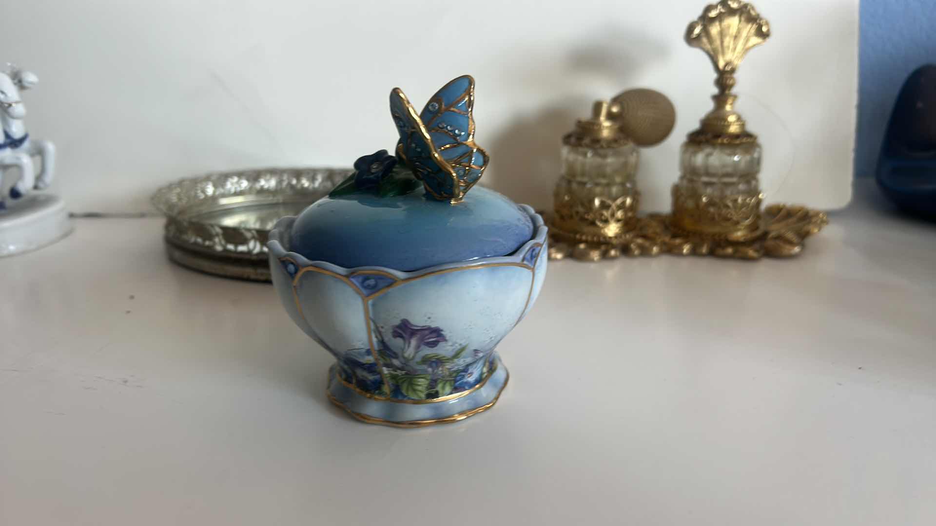 Photo 1 of VINTAGE COLLECTION- PERFUME BOTTLES, NUMBERED MUSIC BOX “WHISPERING WINGS” AND TRAY