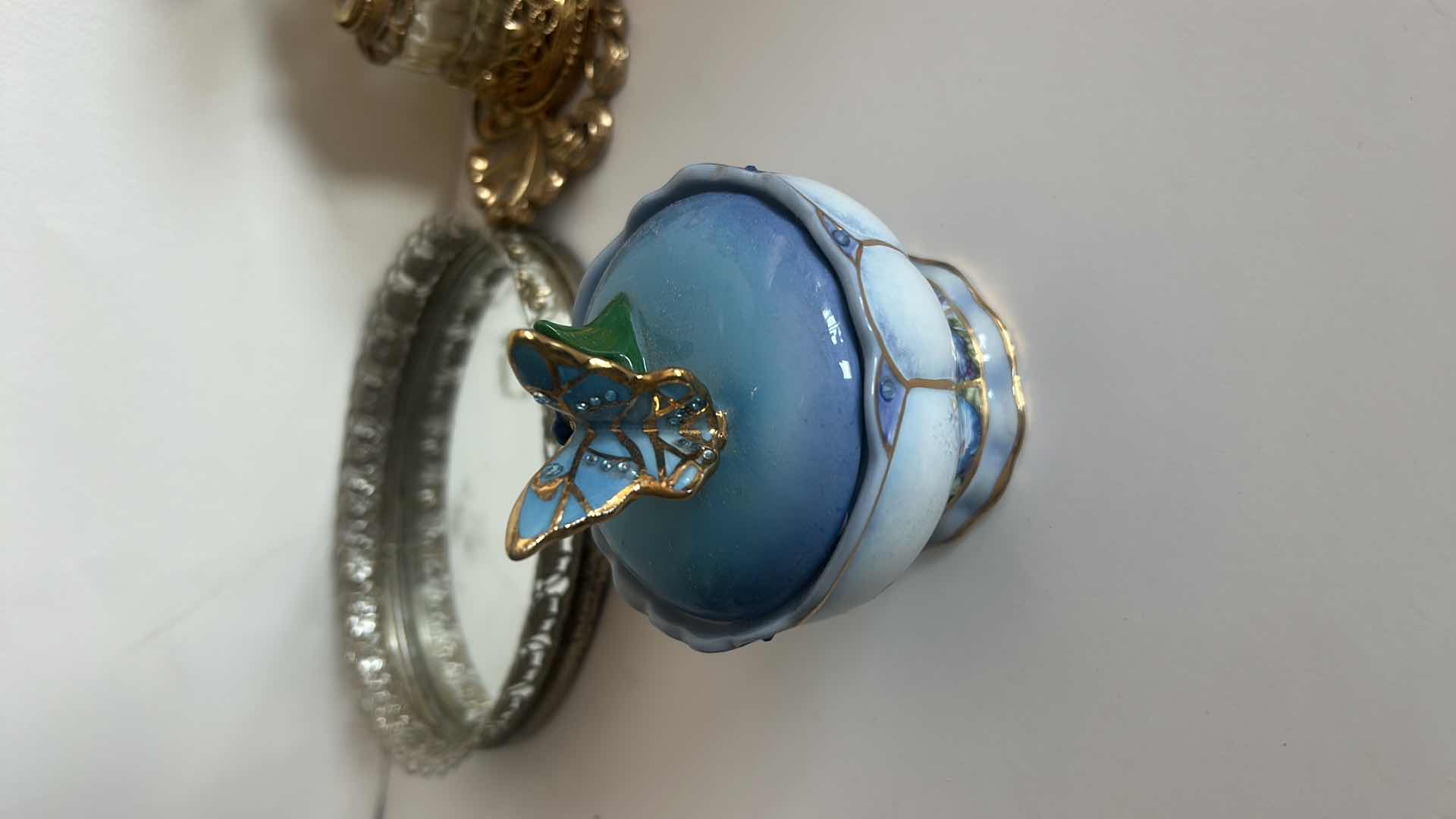 Photo 1 of VINTAGE COLLECTION- PERFUME BOTTLES, NUMBERED MUSIC BOX “WHISPERING WINGS” AND TRAY