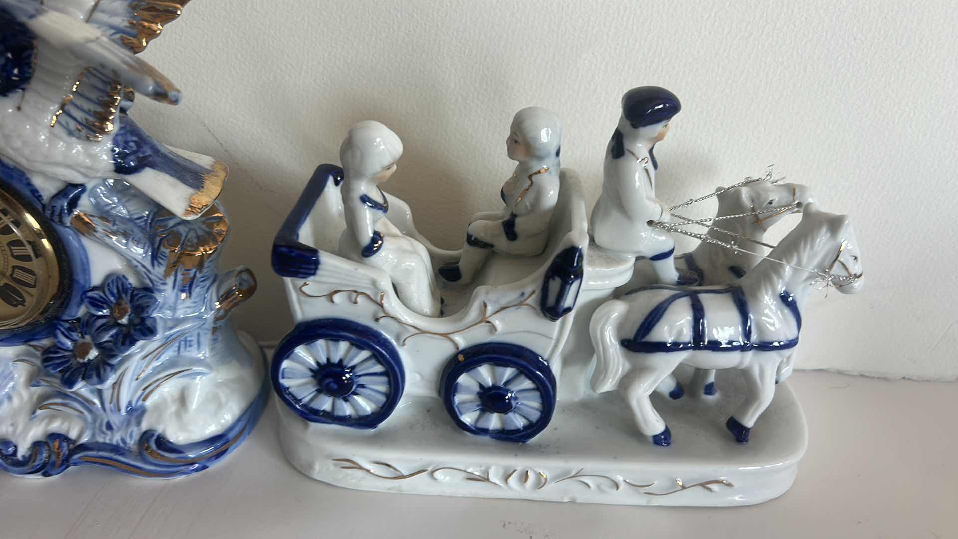 Photo 1 of 2- BLUE AND WHITE PORCELAIN PIECES, MANTLE CLOCK H6.5” AND CARRIAGE