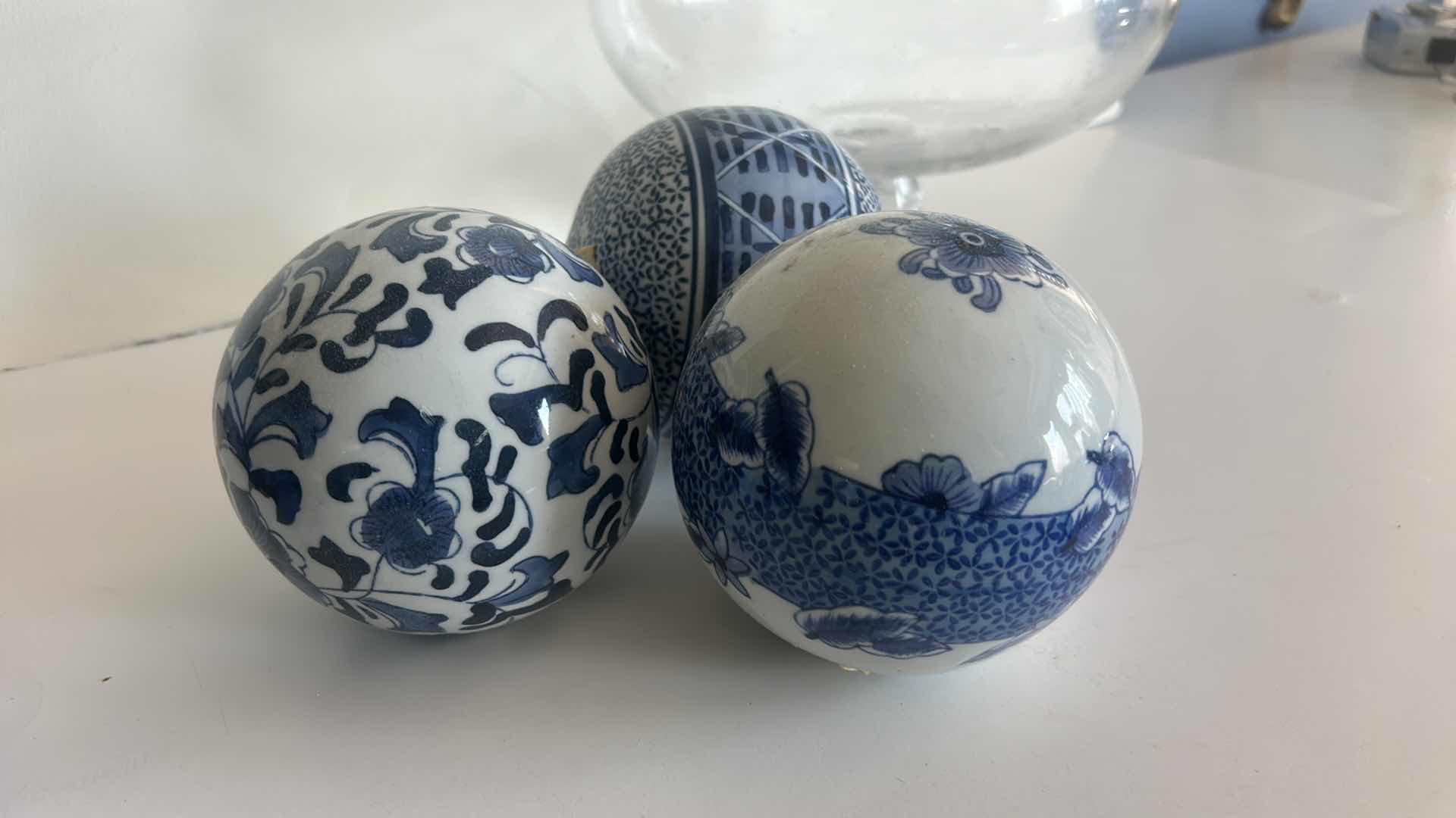 Photo 1 of GLASS LIDDED JAR H15” AND 3 DECORATIVE 5” PORCELAIN ORBS