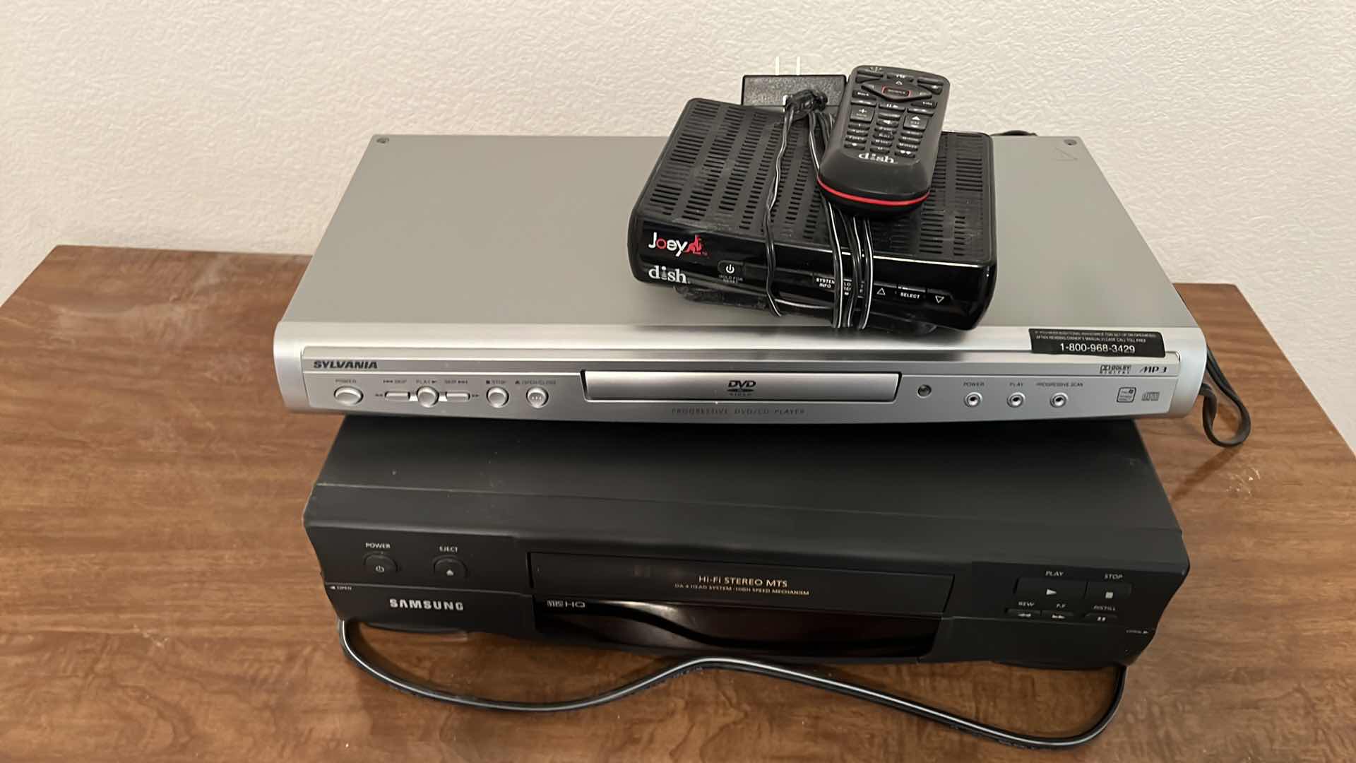 Photo 2 of HOME ELECTRONICS (SAMSUNG VHS PLAYER, SYLVANIA DVD PLAYER & DISH BOX W REMOTE)