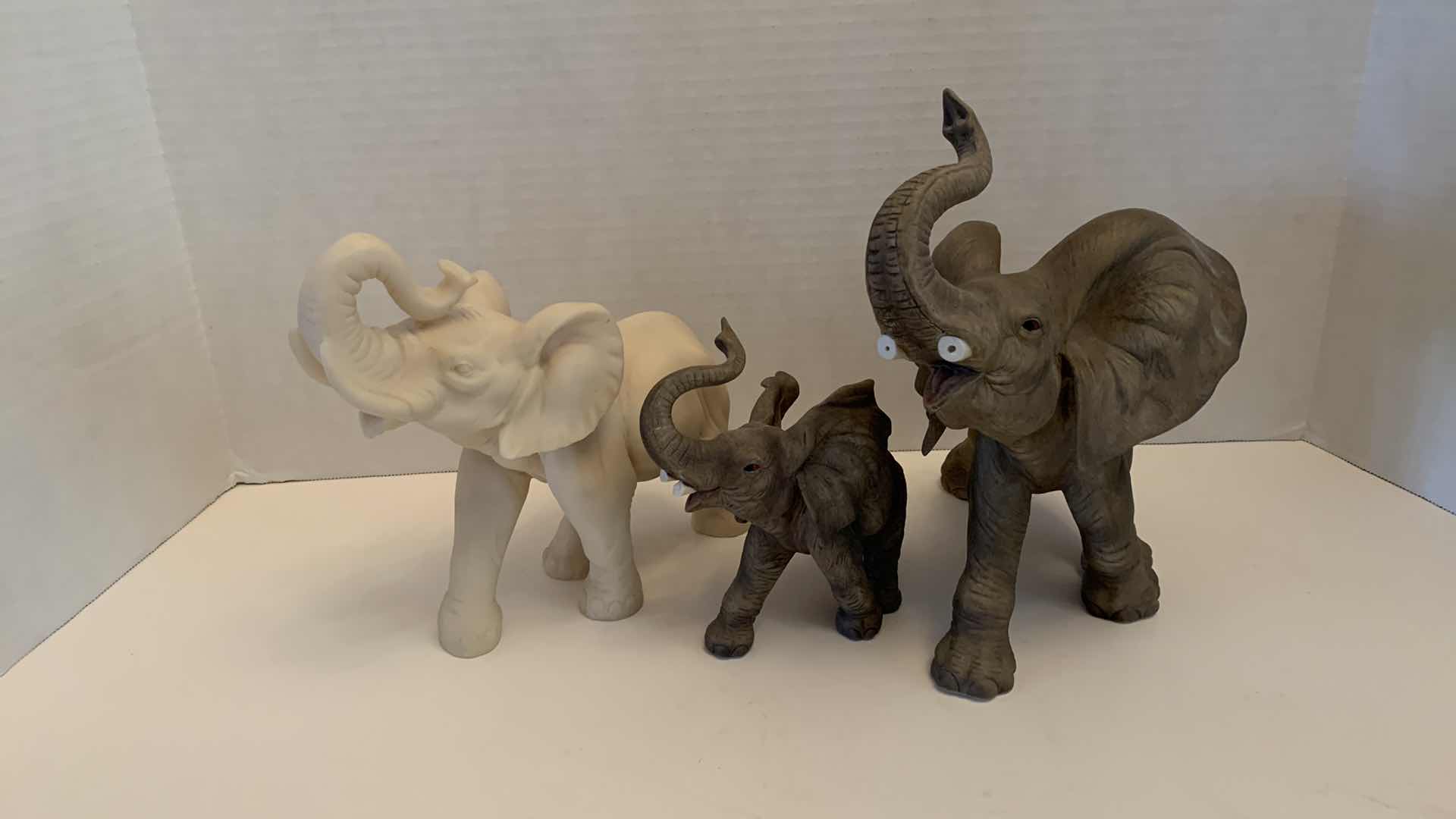 Photo 1 of SET OF THREE PLASTER ELEPHANTS TALLEST IS 9”