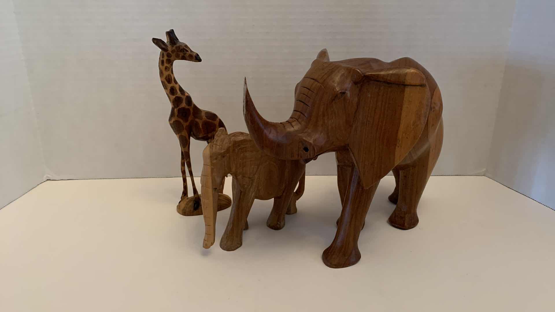 Photo 1 of WOODEN ELEPHANTS AND A GIRAFFE TALLEST 8”