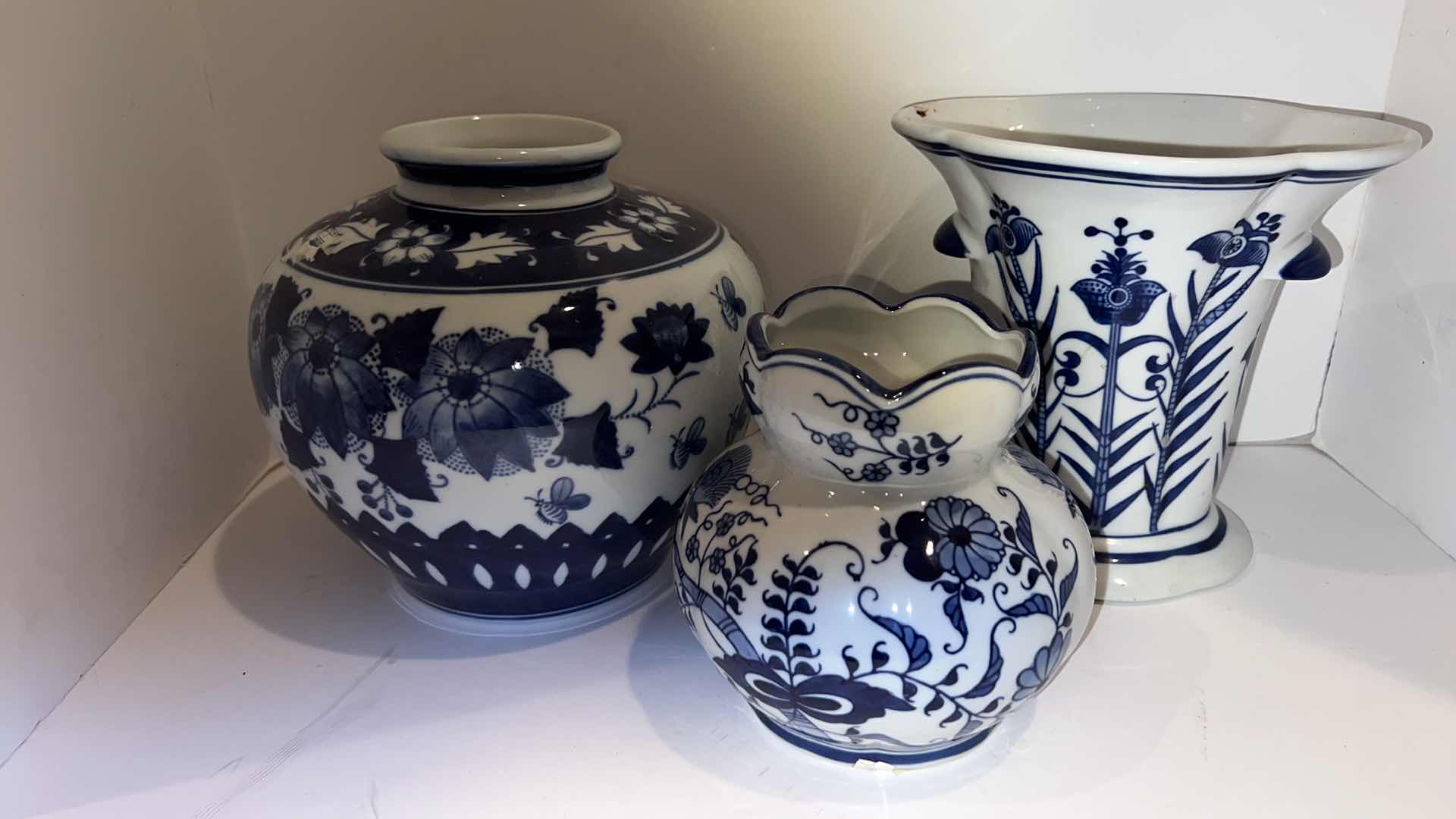 Photo 1 of 3-BLUE & WHITE CERAMIC VASES (TALLEST HEIGHT 8”)