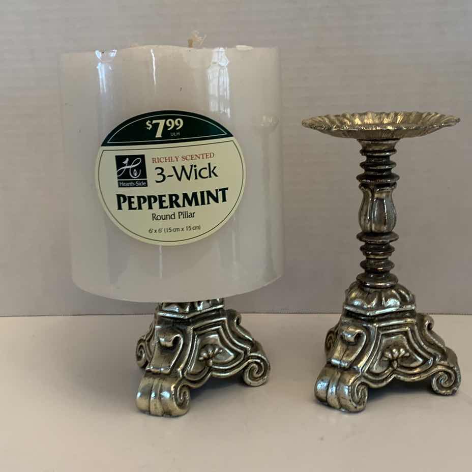 Photo 1 of YWO CANDLESTICKS AND A LARGE CANDLE