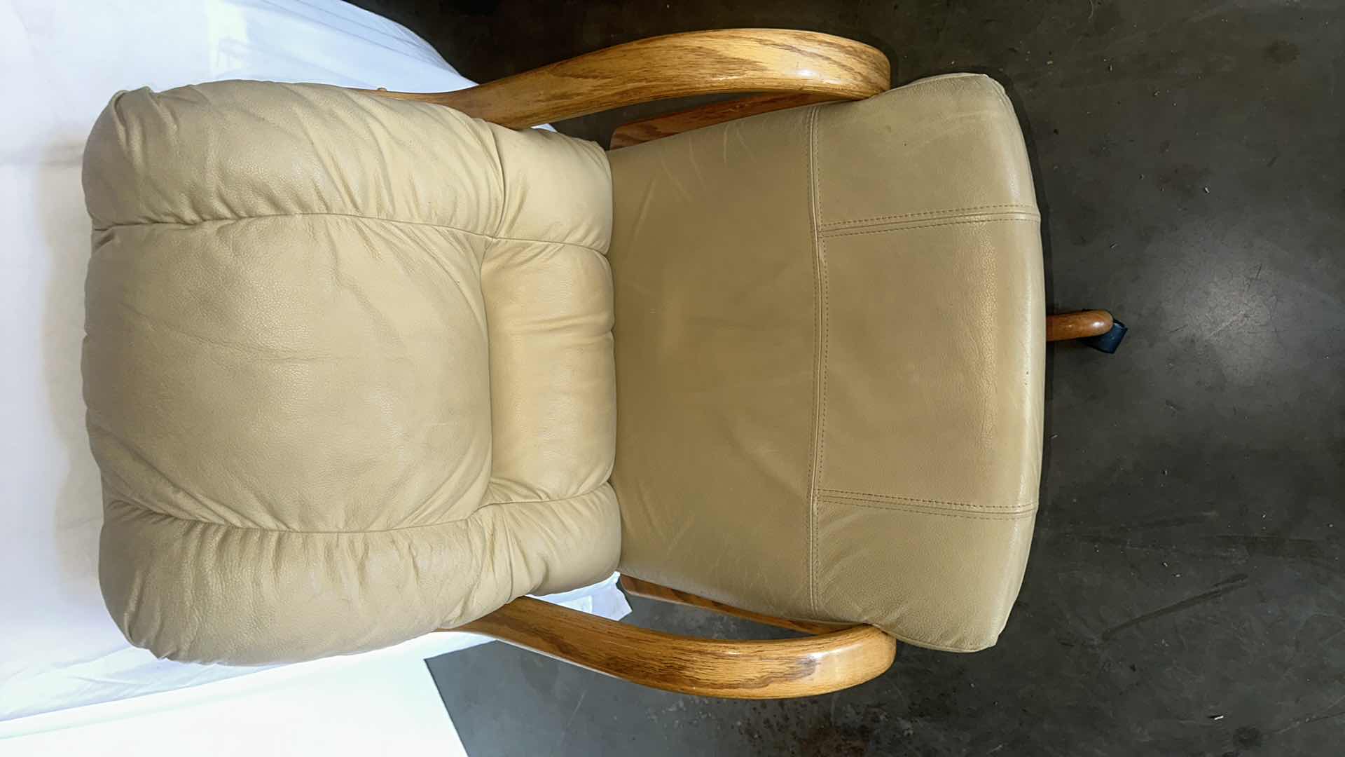 Photo 4 of TAN LEATHER SWIVEL ARM CHAIRS W OAK TRIM