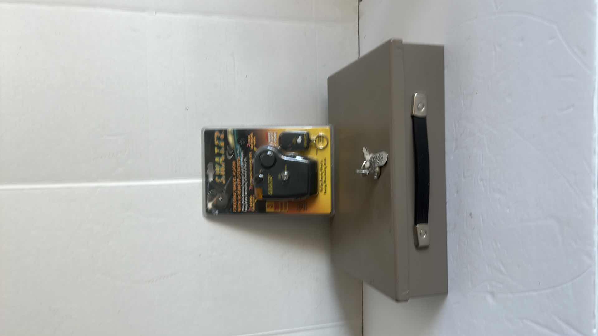 Photo 1 of METAL LOCK BOX AND WHEEL ALARM