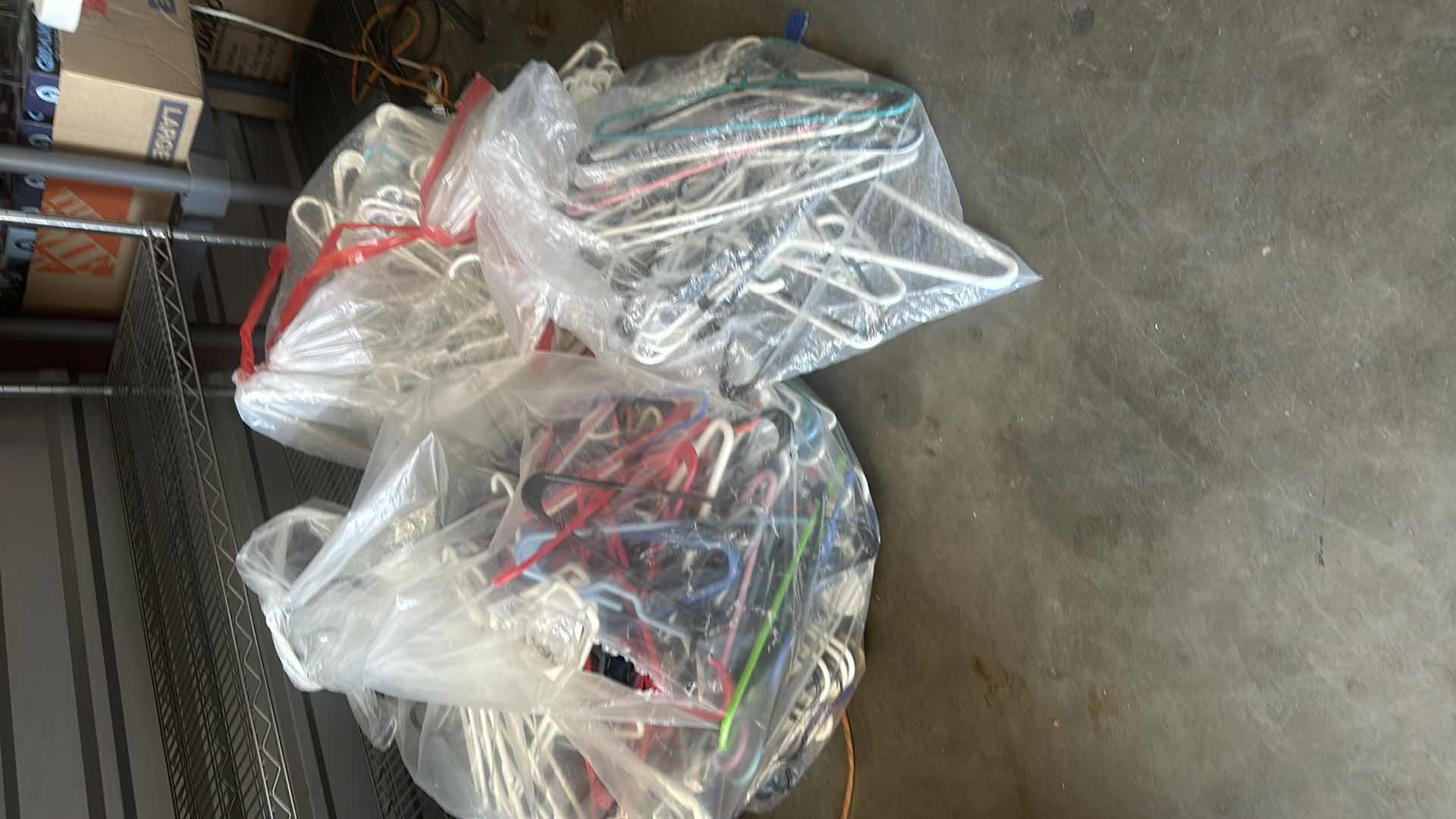 Photo 1 of BAGS OF PLASTIC HANGERS