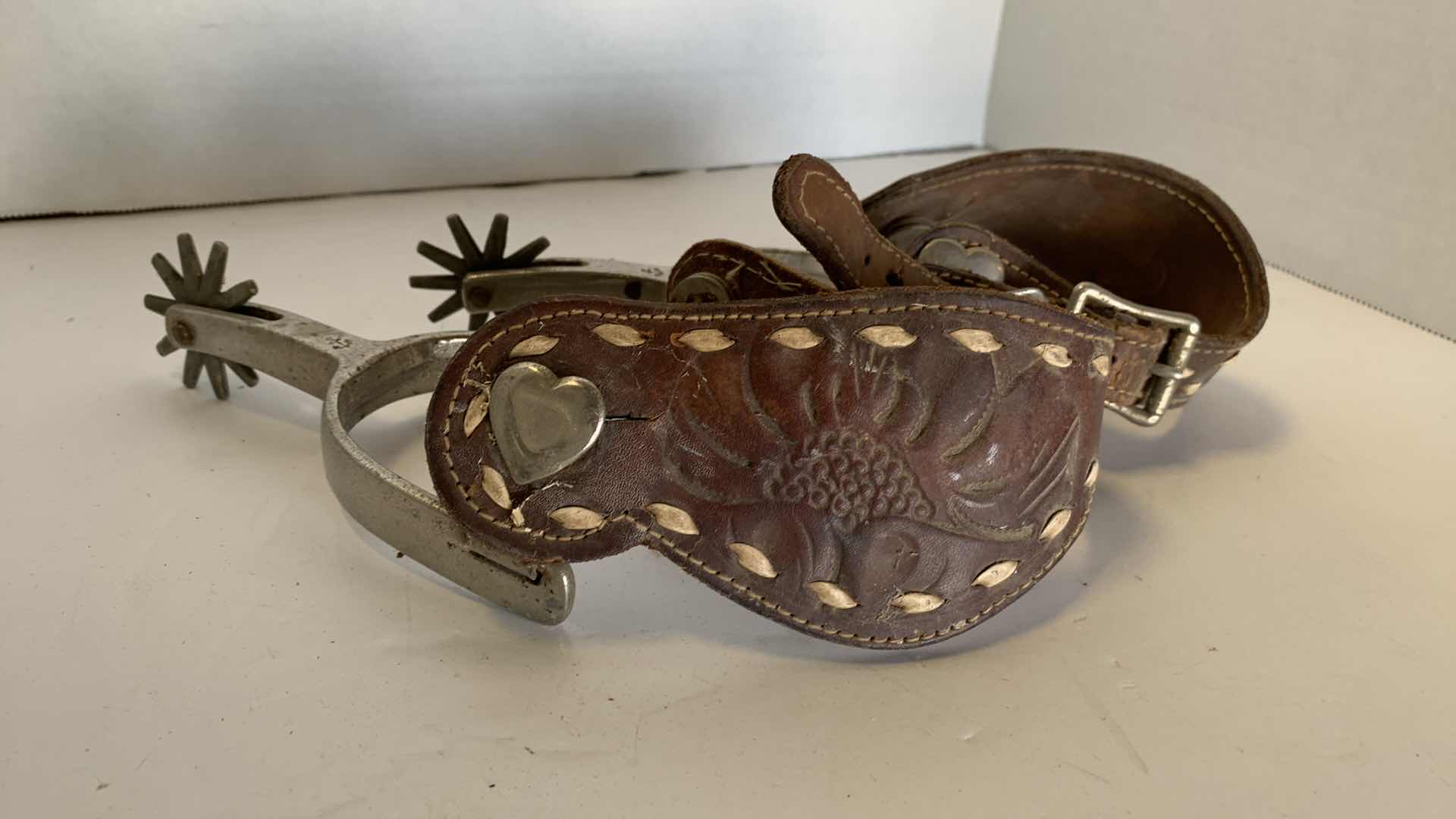 Photo 1 of ANTIQUE NICKEL OVER METAL LEATHER "NORTH AND JUDD" COWBOY SPURS