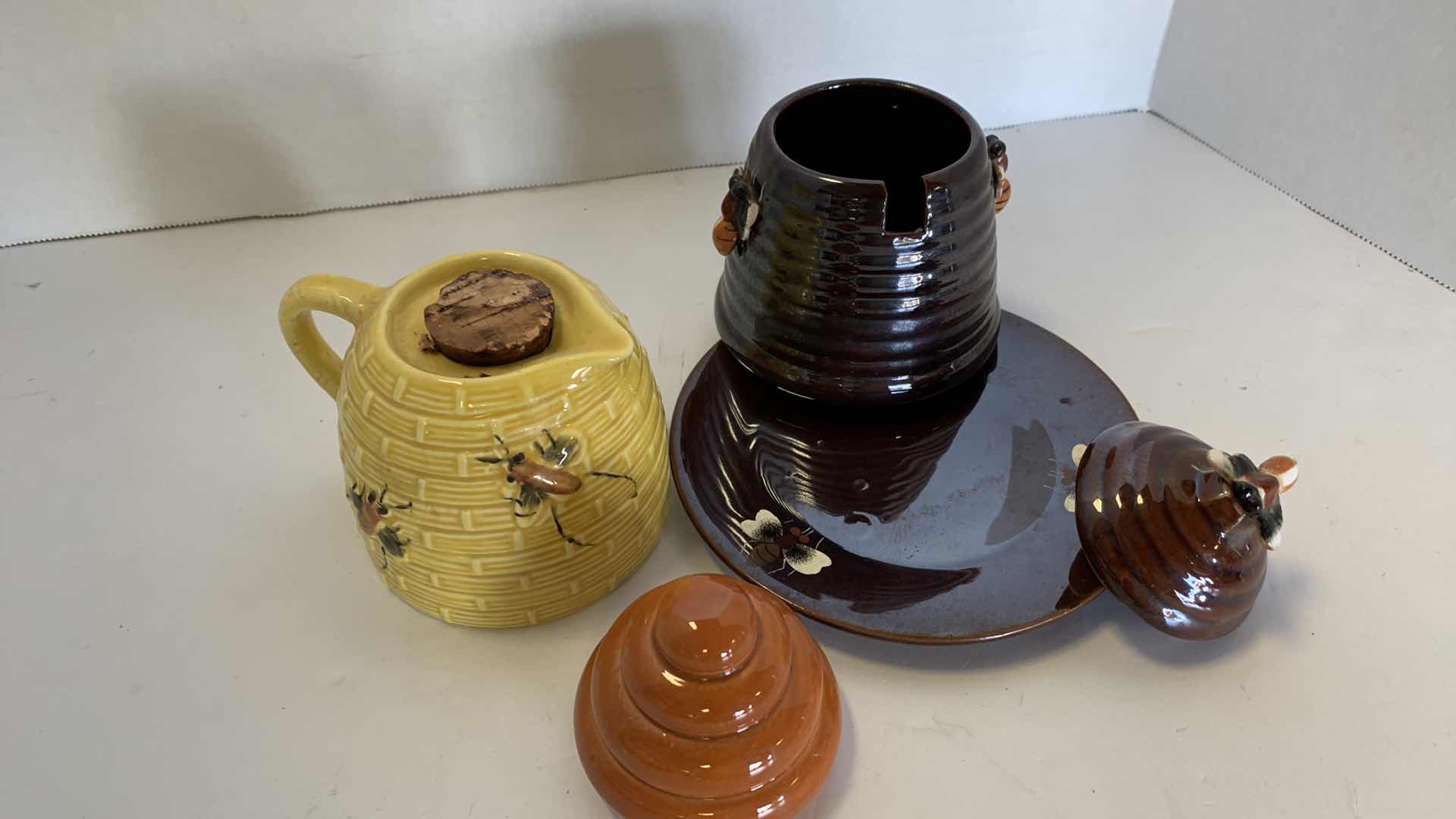 Photo 2 of 2- VINTAGE LUSTERWARE CERAMIC BEE HIVE HONEY POT AND SYRUP DISPENSER.