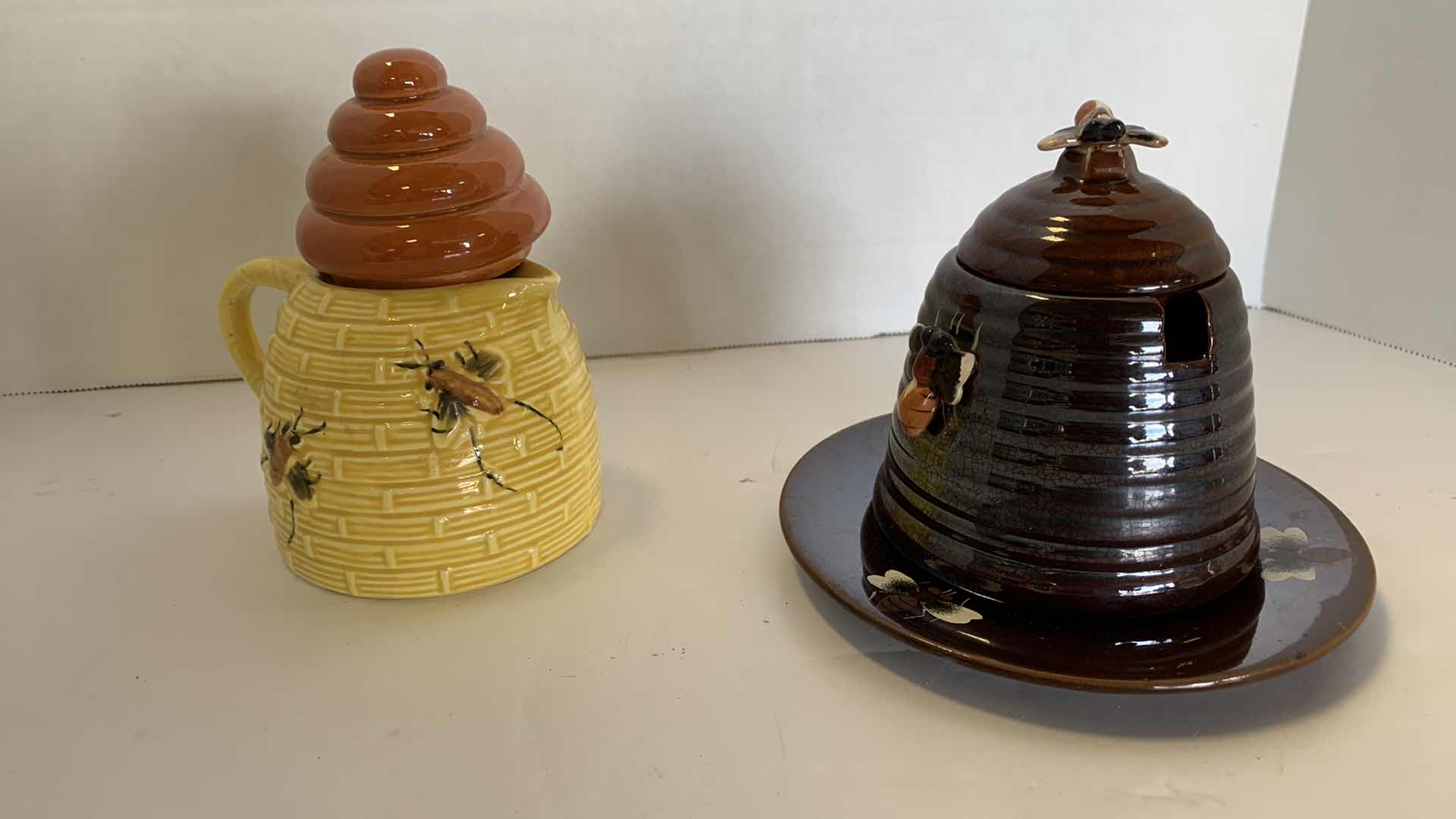 Photo 1 of 2- VINTAGE LUSTERWARE CERAMIC BEE HIVE HONEY POT AND SYRUP DISPENSER.