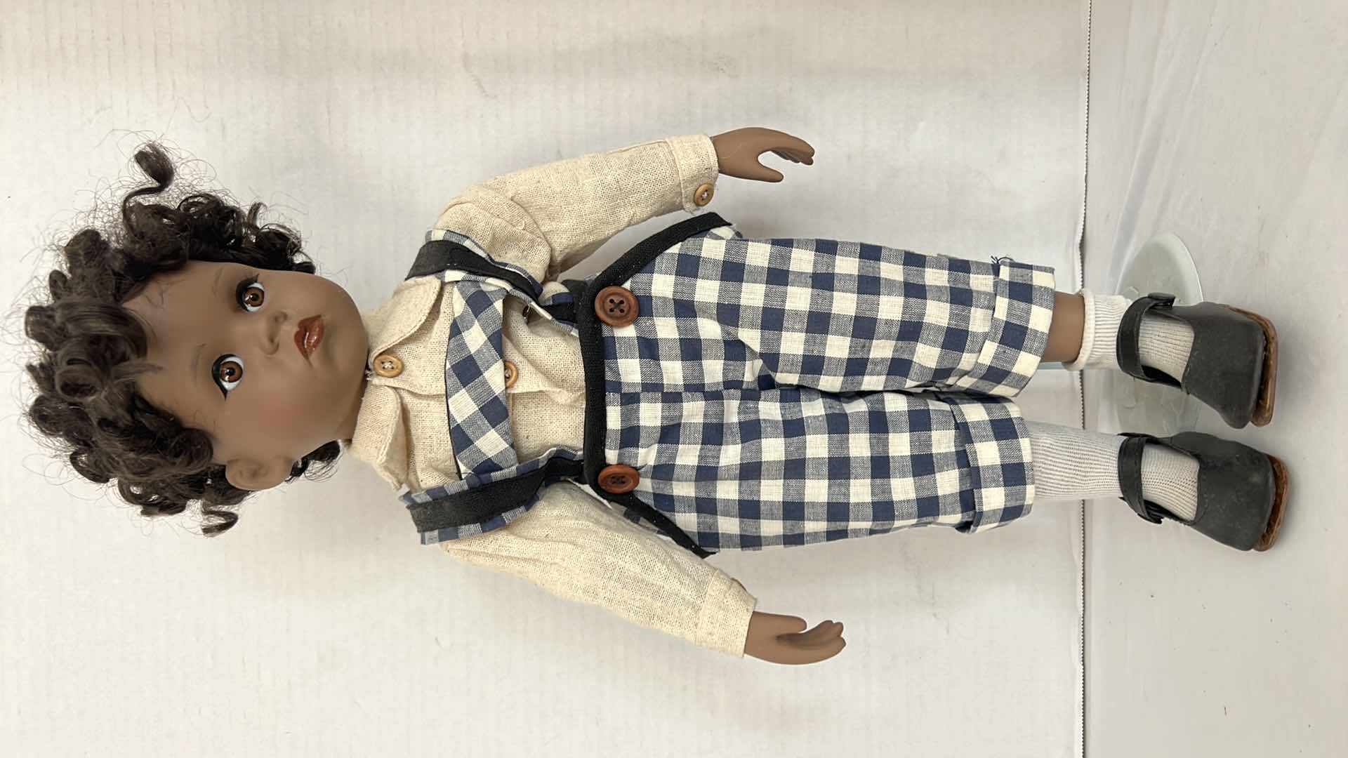 Photo 1 of AFRICAN AMERICAN PORCELAIN DOLL W STAND H20"