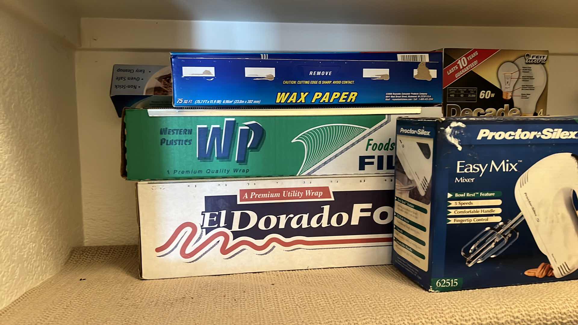 Photo 2 of CONTENTS OF PANTRY SHELF-PLASTC CANISTERS, LIGHT BULBS, MIXER, WRAP