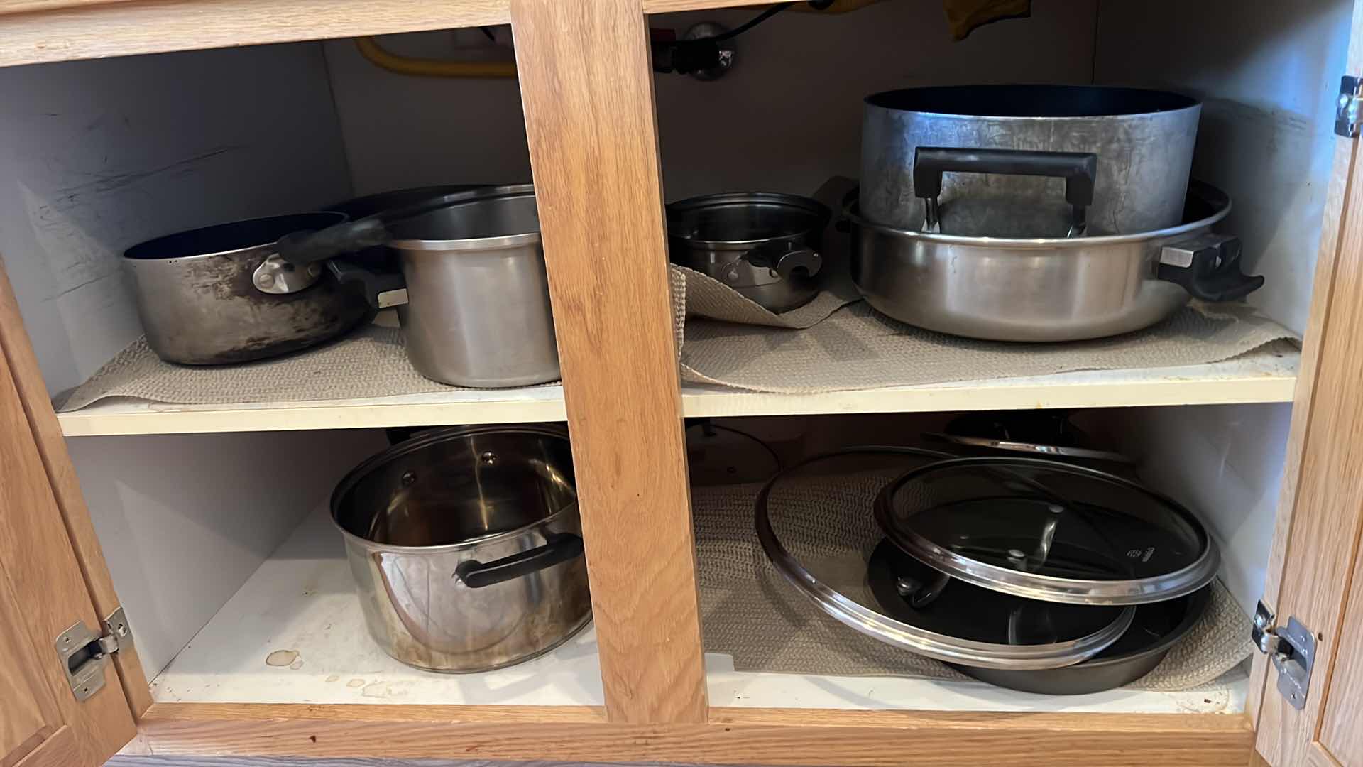 Photo 1 of CONTENTS OF KITCHEN CABINET-POTS & PANS