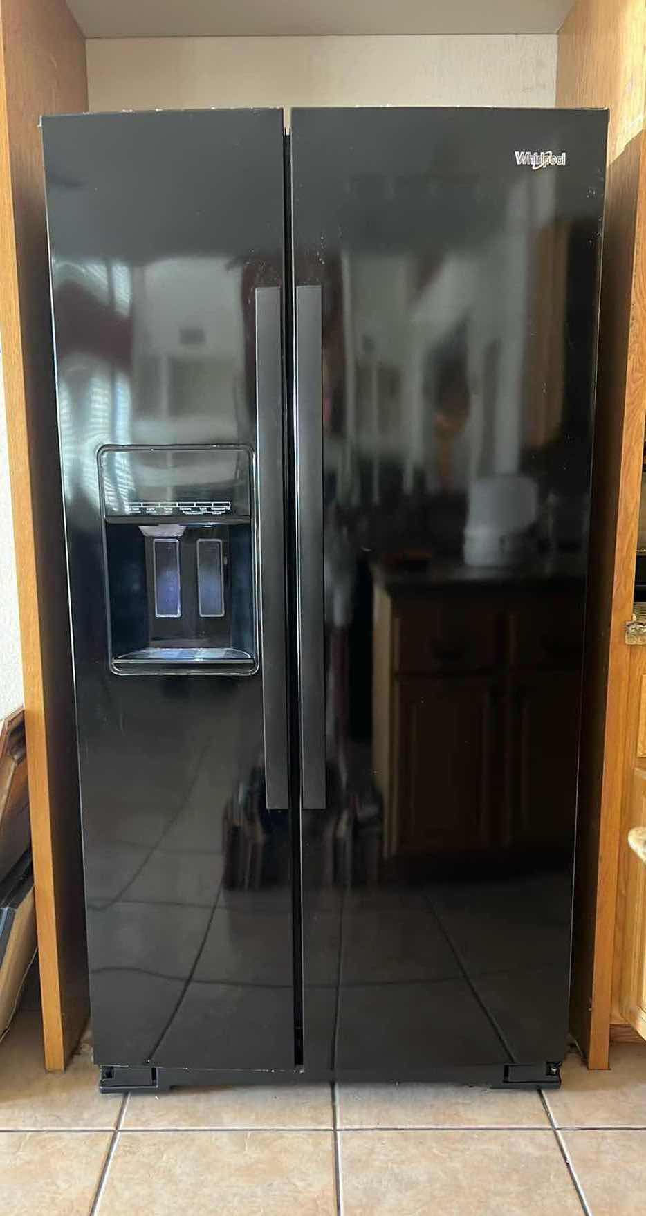 Photo 1 of BLACK WHIRLPOOL SIDE BY SIDE REFRIGERATOR (CONTENTS NOT INCLUDED)