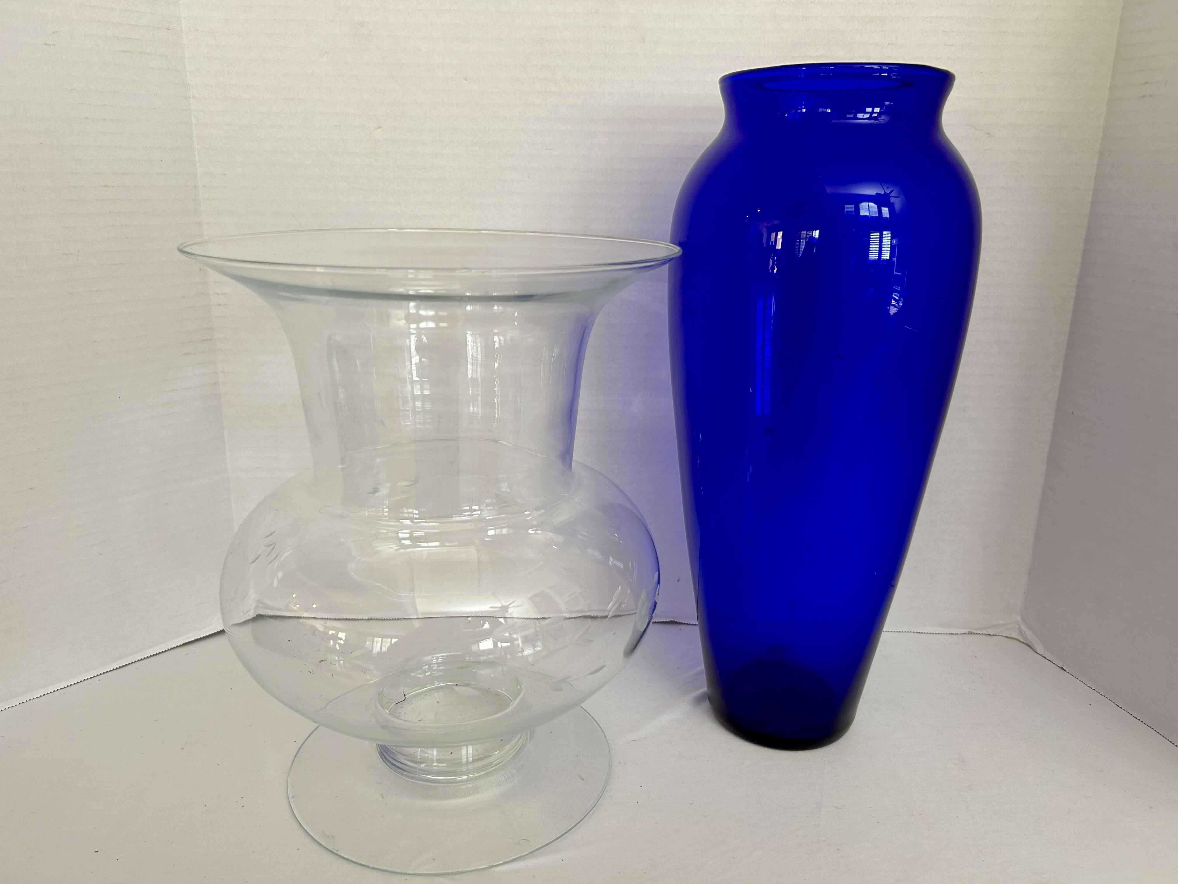 Photo 1 of 2 LARGE GLASS VASES IN CLEAR H12” AND BLUE H16”