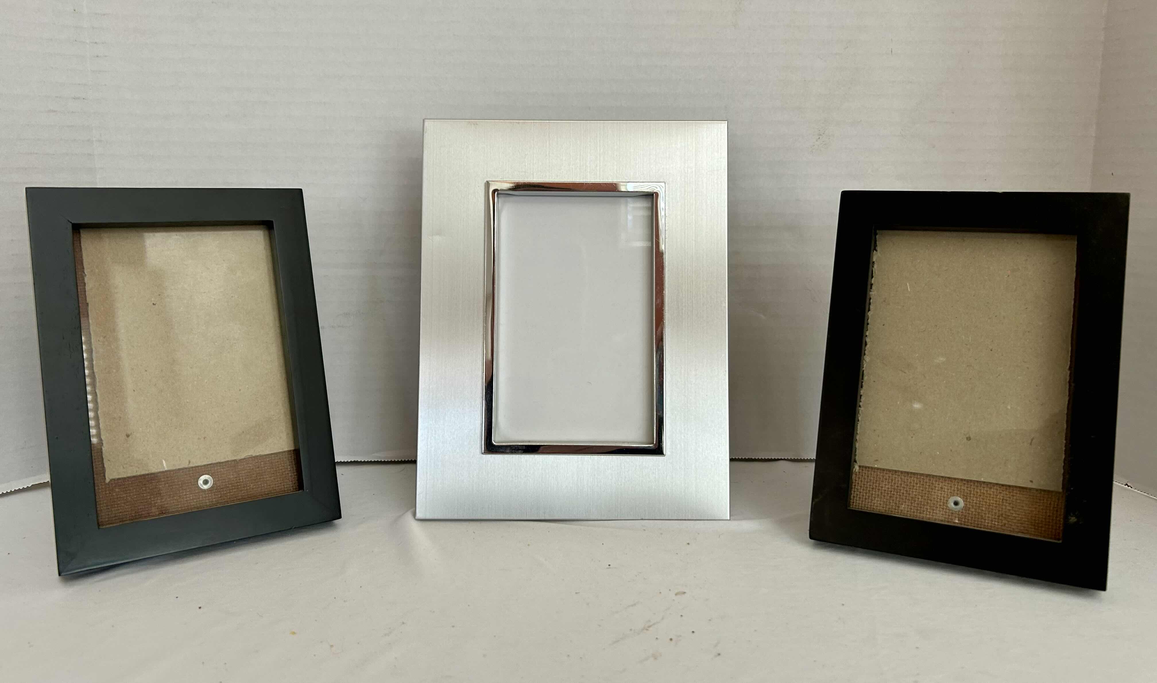 Photo 1 of 3 5”X7” FRAMES. 2 BLACK, 1 SILVER