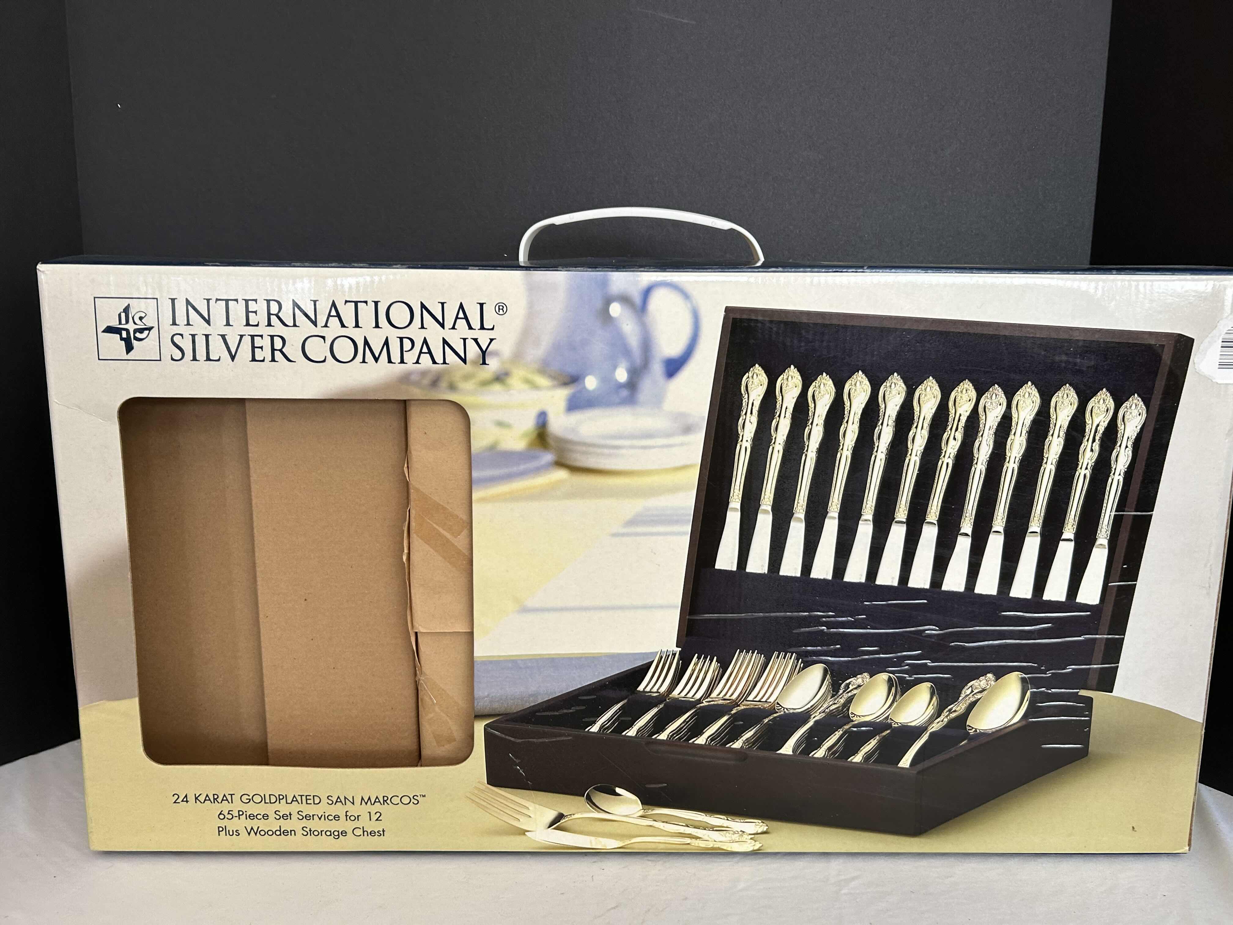 Photo 2 of NIB INTERNATIONAL SILVER COMPANY 24 KARAT GOLD PLATED SAN MARCOS 65 PIECE SET, SERVICE FOR 12 PLUS WOODEN STORAGE. 
$160.00