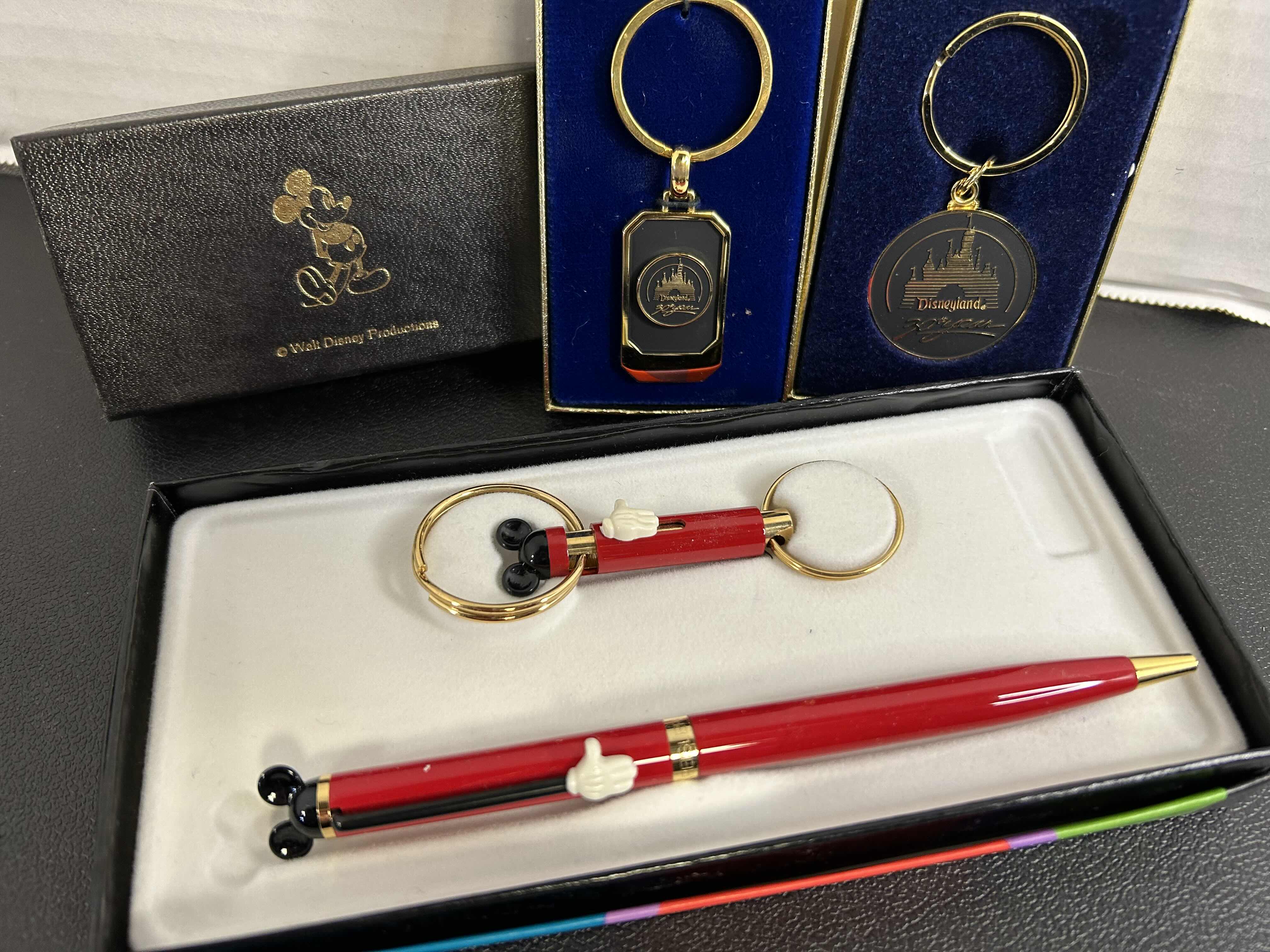 Photo 1 of 3-DISNEY KEYCHAINS AND 1 DISNEY INK PEN