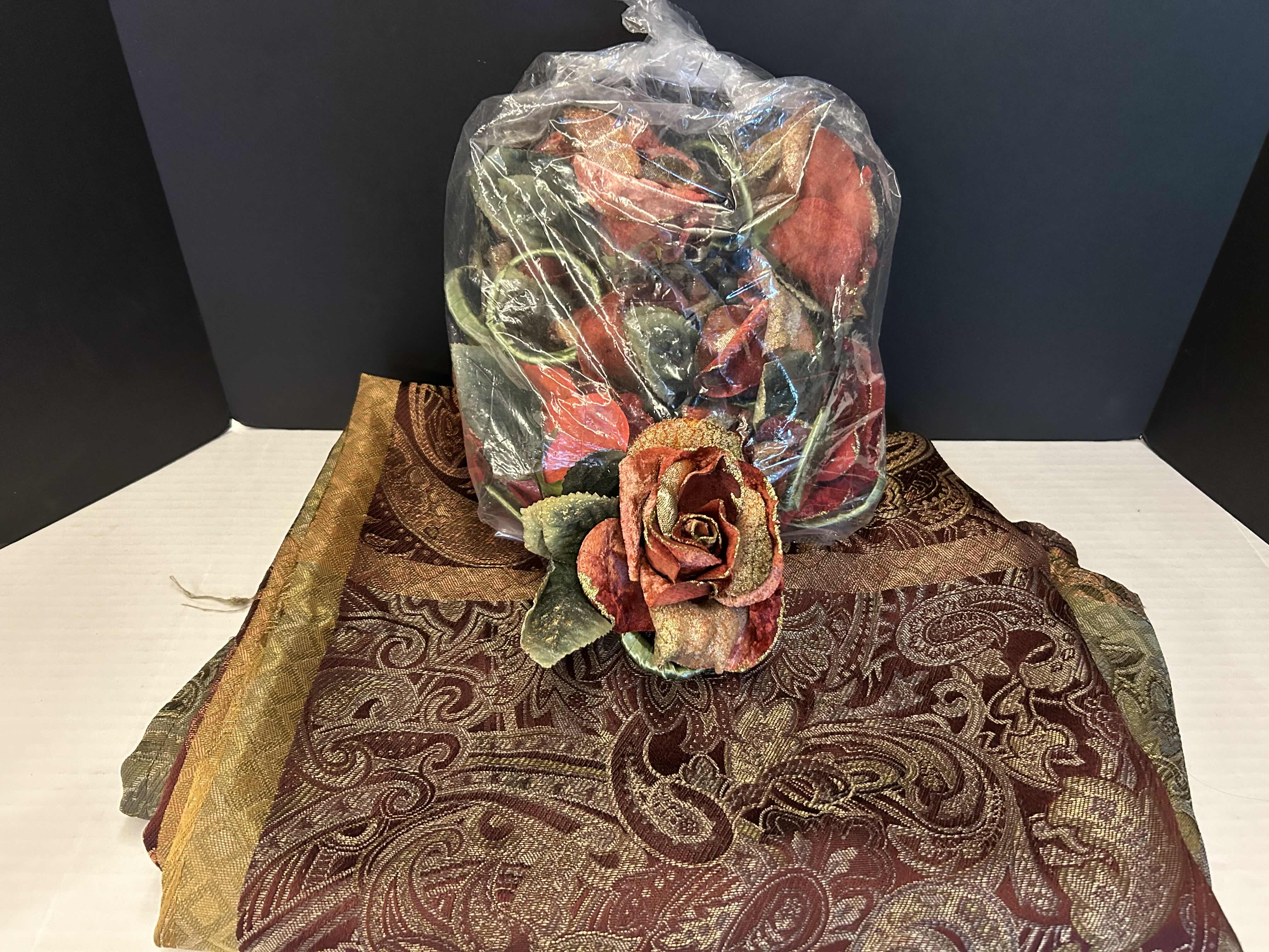 Photo 1 of PAISLEY TABLECLOTH AND BAG OF FLORAL NAPKIN RINGS