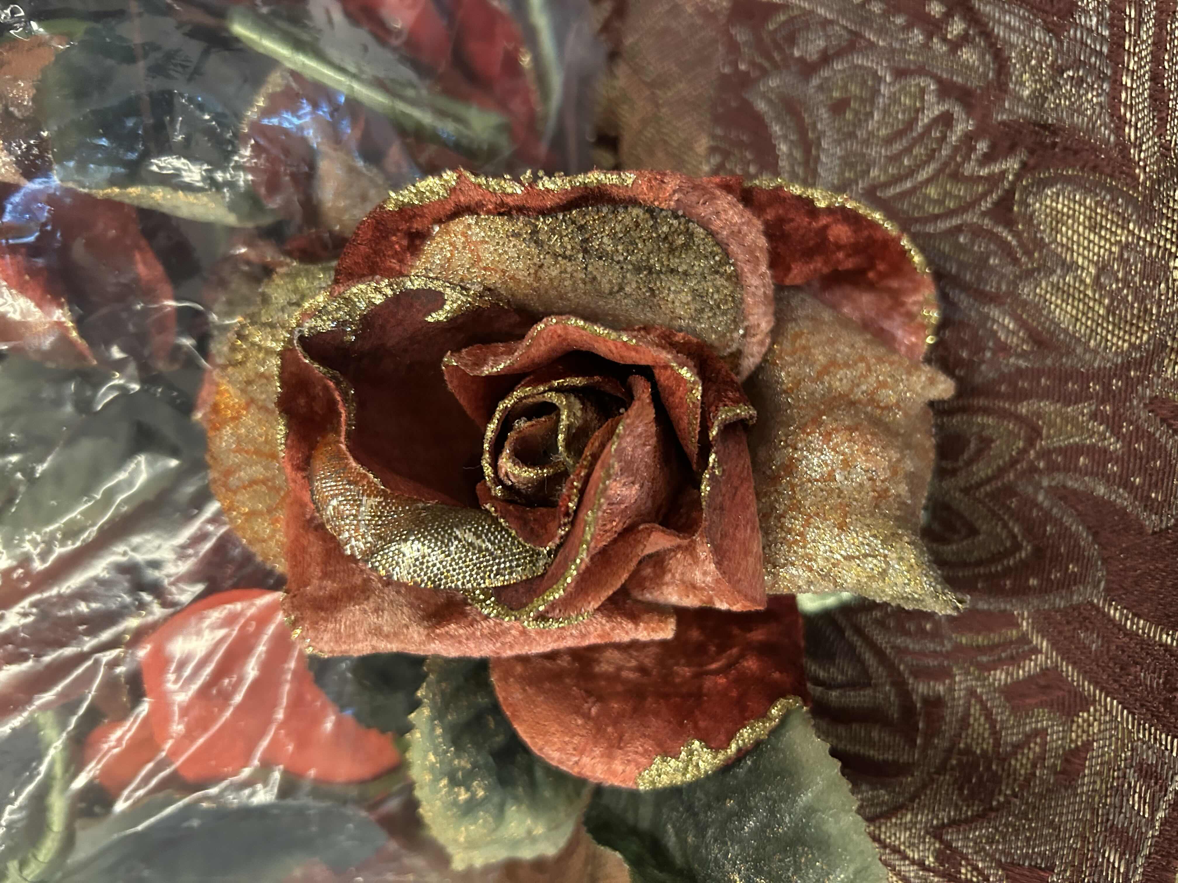 Photo 2 of PAISLEY TABLECLOTH AND BAG OF FLORAL NAPKIN RINGS