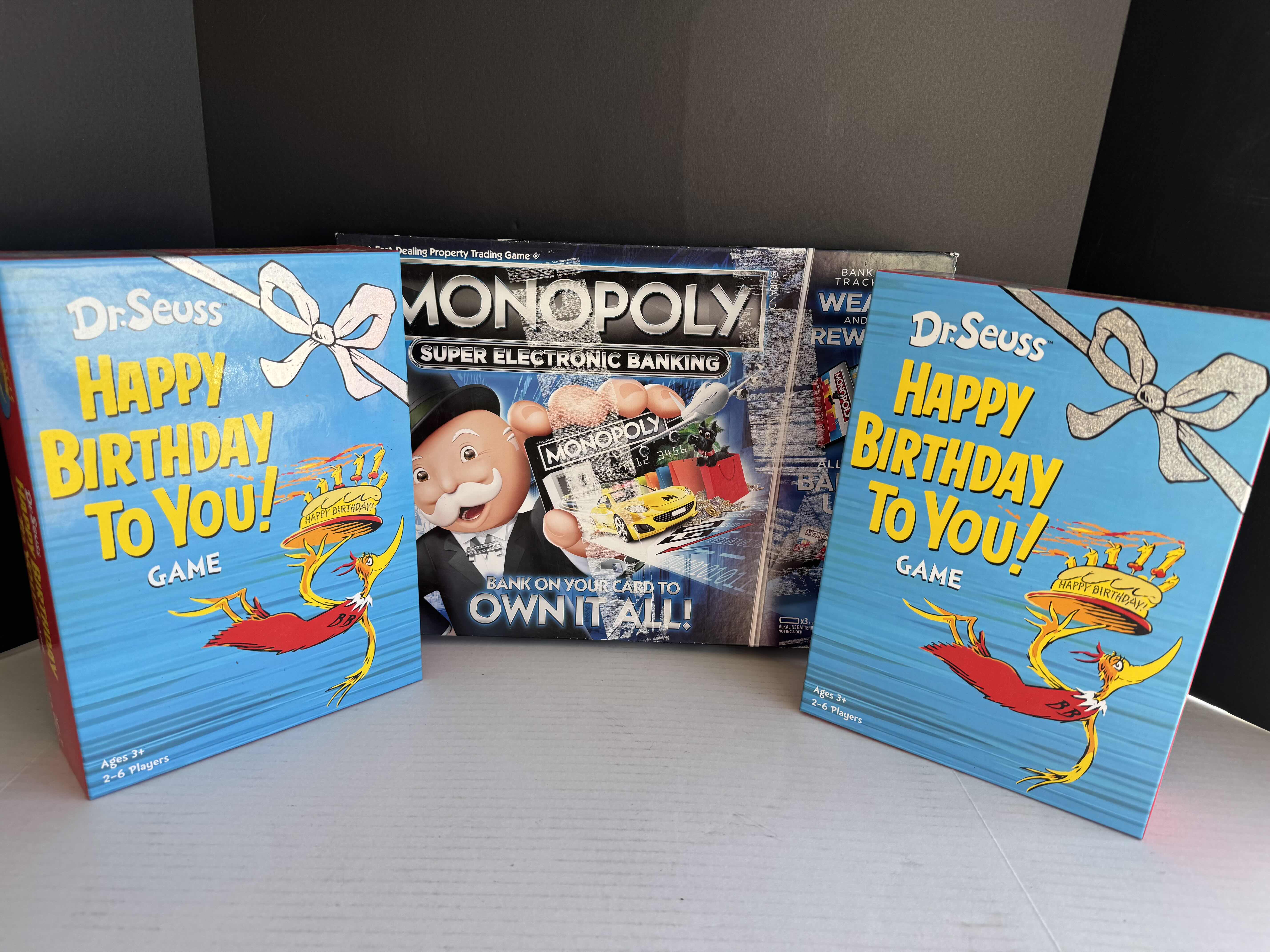 Photo 1 of 2 BRAND NEW FUNKO DR. SEUSS HAPPY BIRTHDAY TO YOU GAME AND 1 BRAND NEW HASBRO MONOPOLY SUPER ELECTRONIC BANKING BOARD GAME