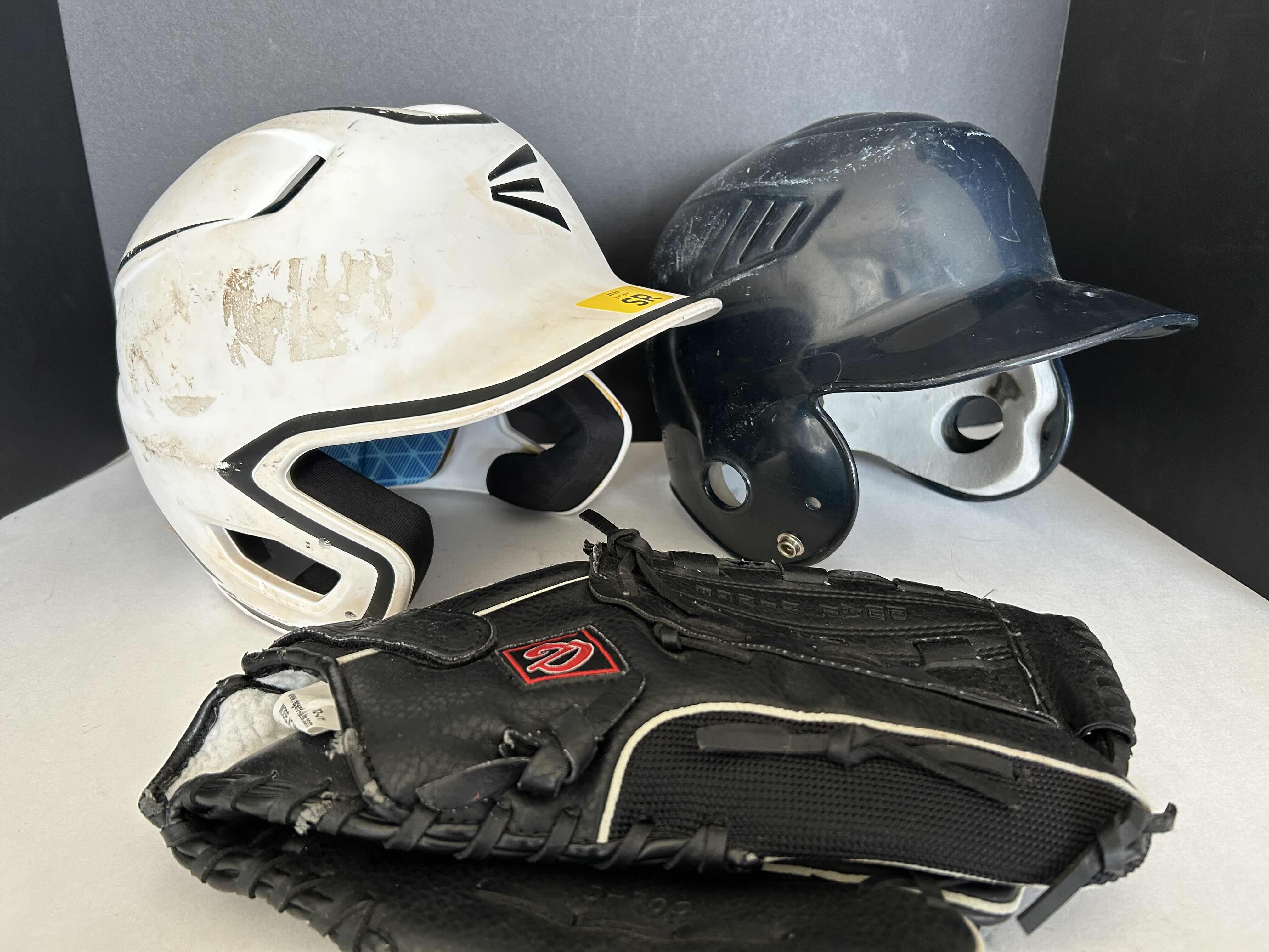 Photo 1 of 2 BASEBALL HELMETS AND 1 GLOVE - WHITE EASTON HELMET SIZE 7 1/8”-7 1/2” BLACK RAWLINGS HELMET SIZE 6 1/4”-7 7/8”