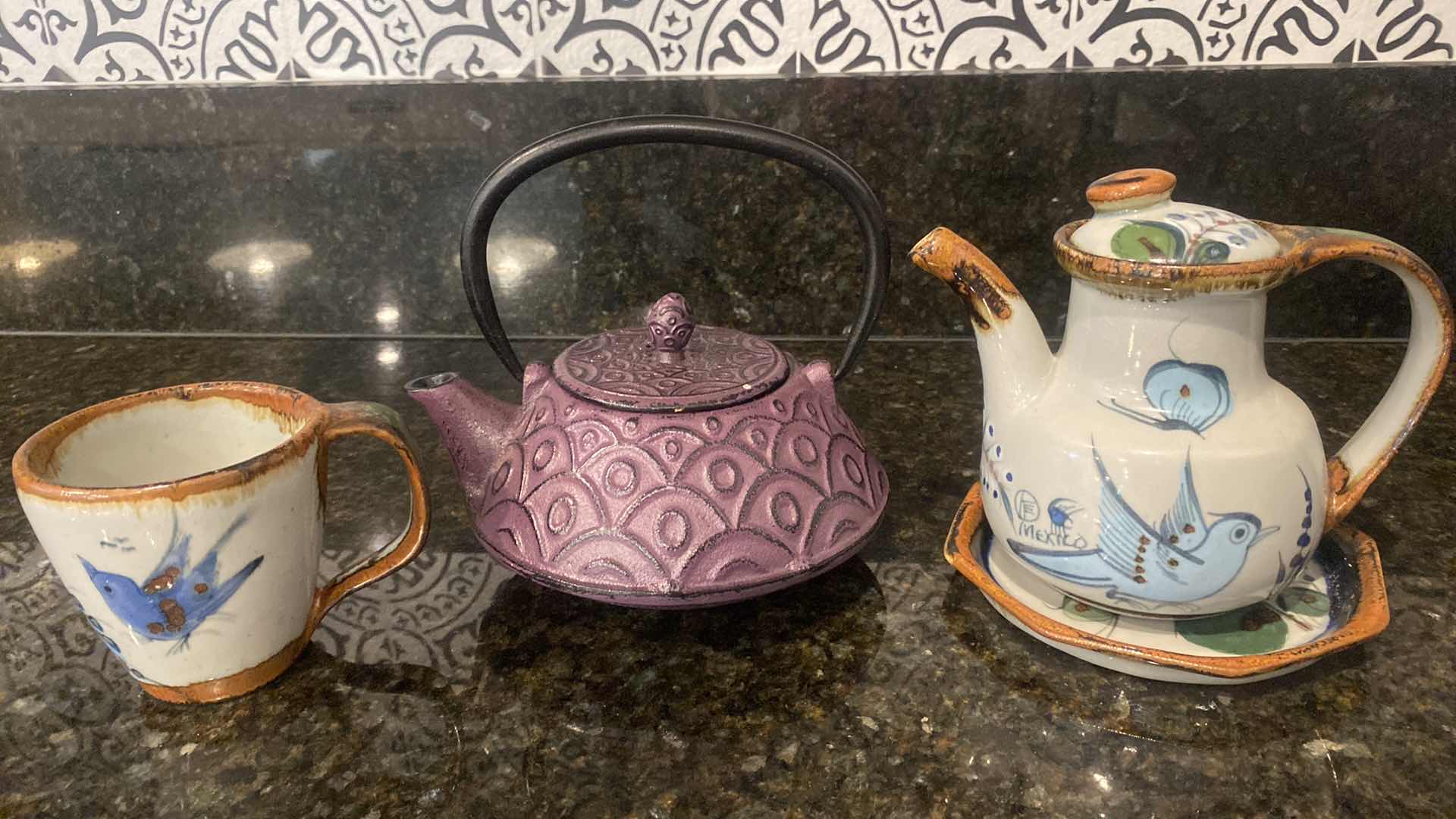 Photo 1 of METAL TEA KETTLE AND CLAY TEA SET