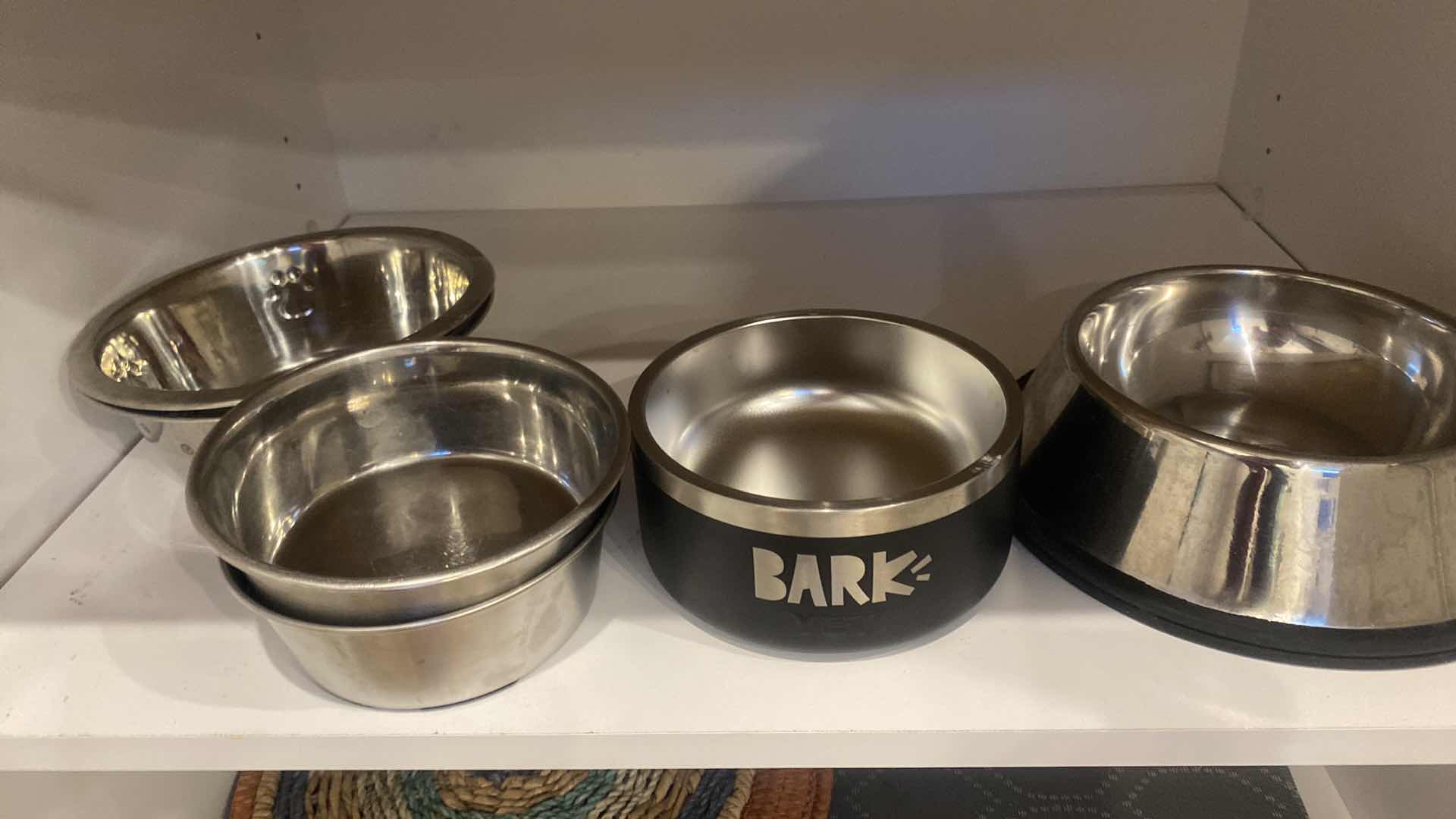 Photo 2 of CONTENTS OF KITCHEN CABINET DOG BOWLS & PLACEMATS