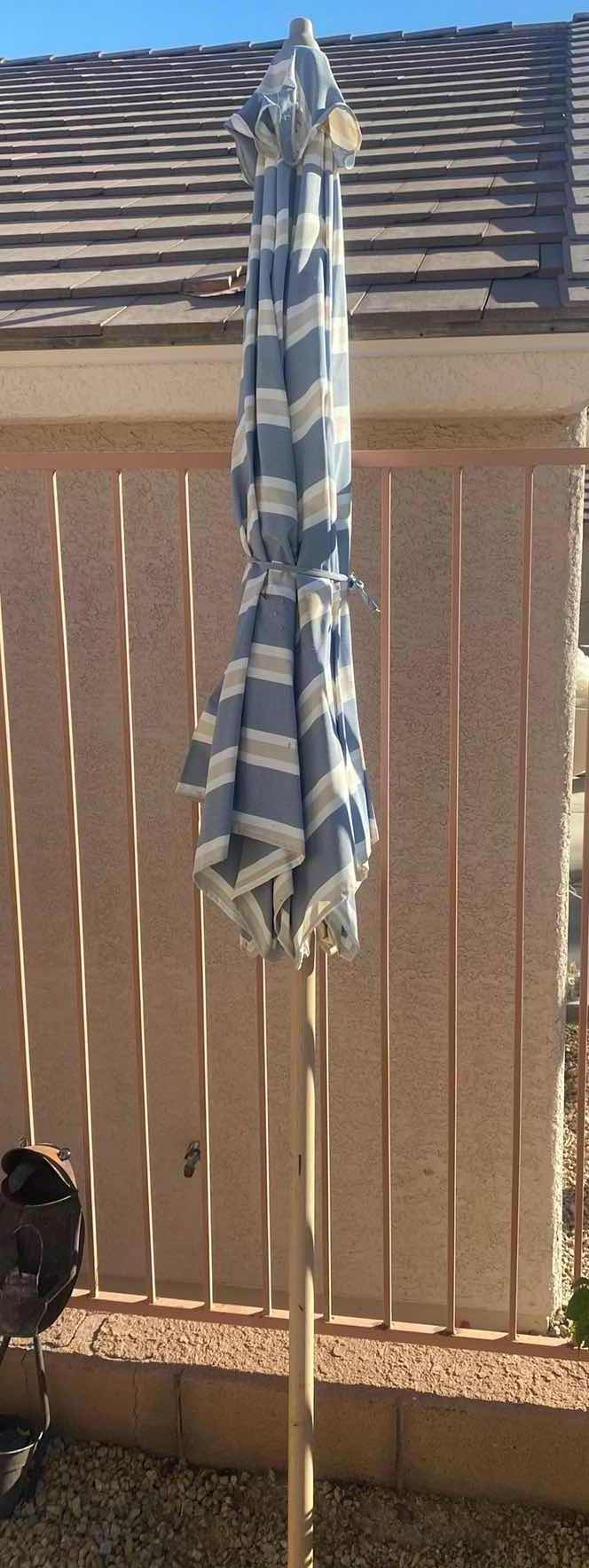 Photo 1 of BLUE & TAN STRIPED PATIO UMBRELLA 8’