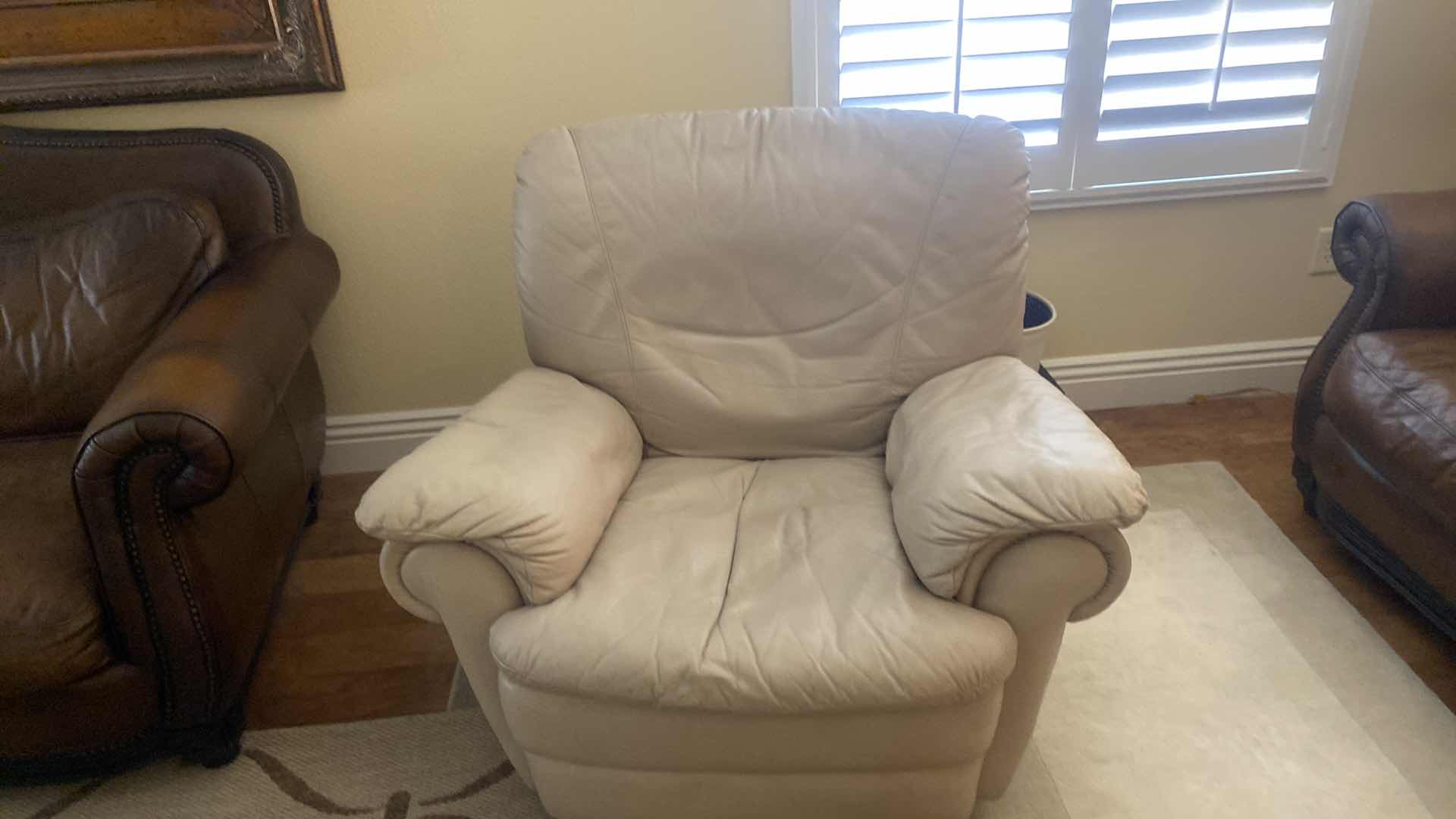 Photo 2 of BEIGE SWIVEL MANUAL LEATHER RECLINER 42“ x 36“ H 34”