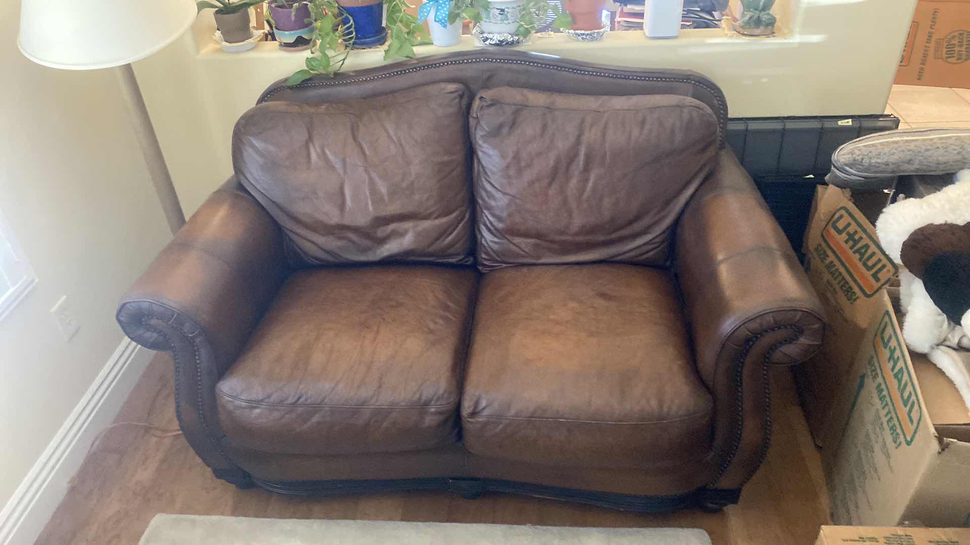 Photo 2 of 67” LEATHER MART BROWN WITH ROLLED ARMS & NAILHEAD TRIM LOVESEAT