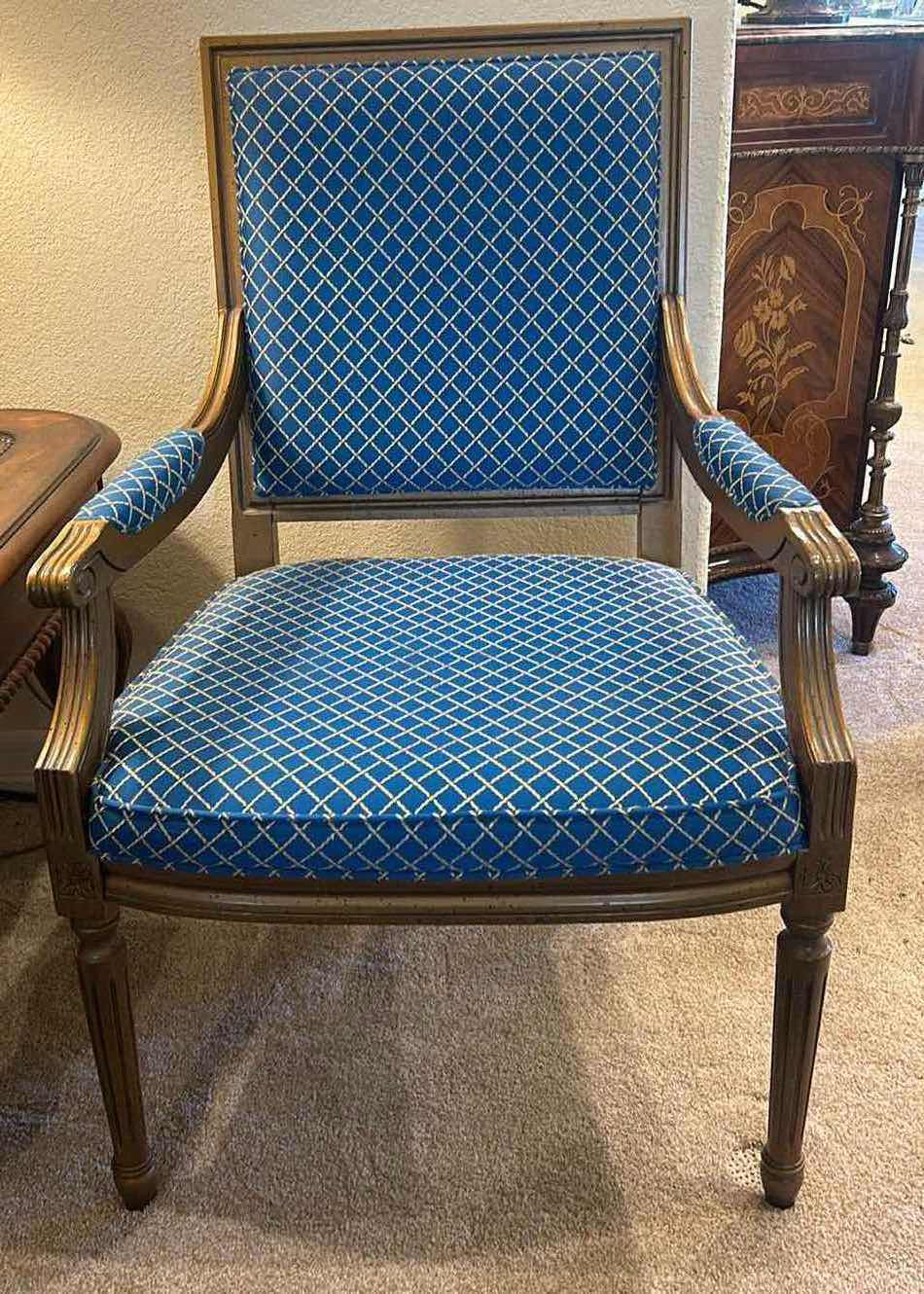 Photo 1 of DELTA FURNITIRE WOOD ARMCHAIR WITH BLUE AND GOLD UPHOLSTERY.