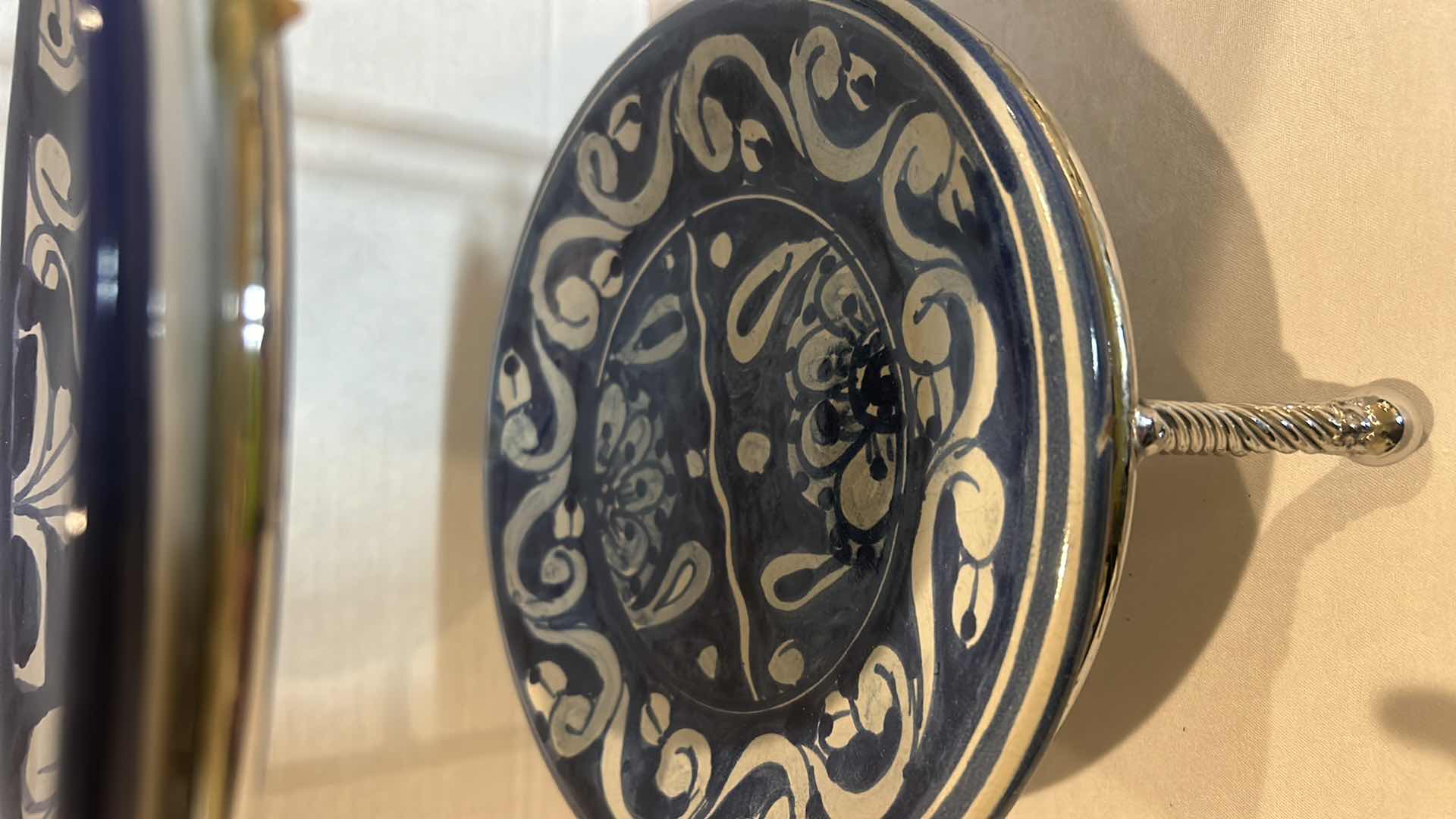 Photo 2 of THREE-TIERED PLATE HOLDER WITH BLUE AND WHITE STONEWARE PLATES FROM MEXICO. H 19”