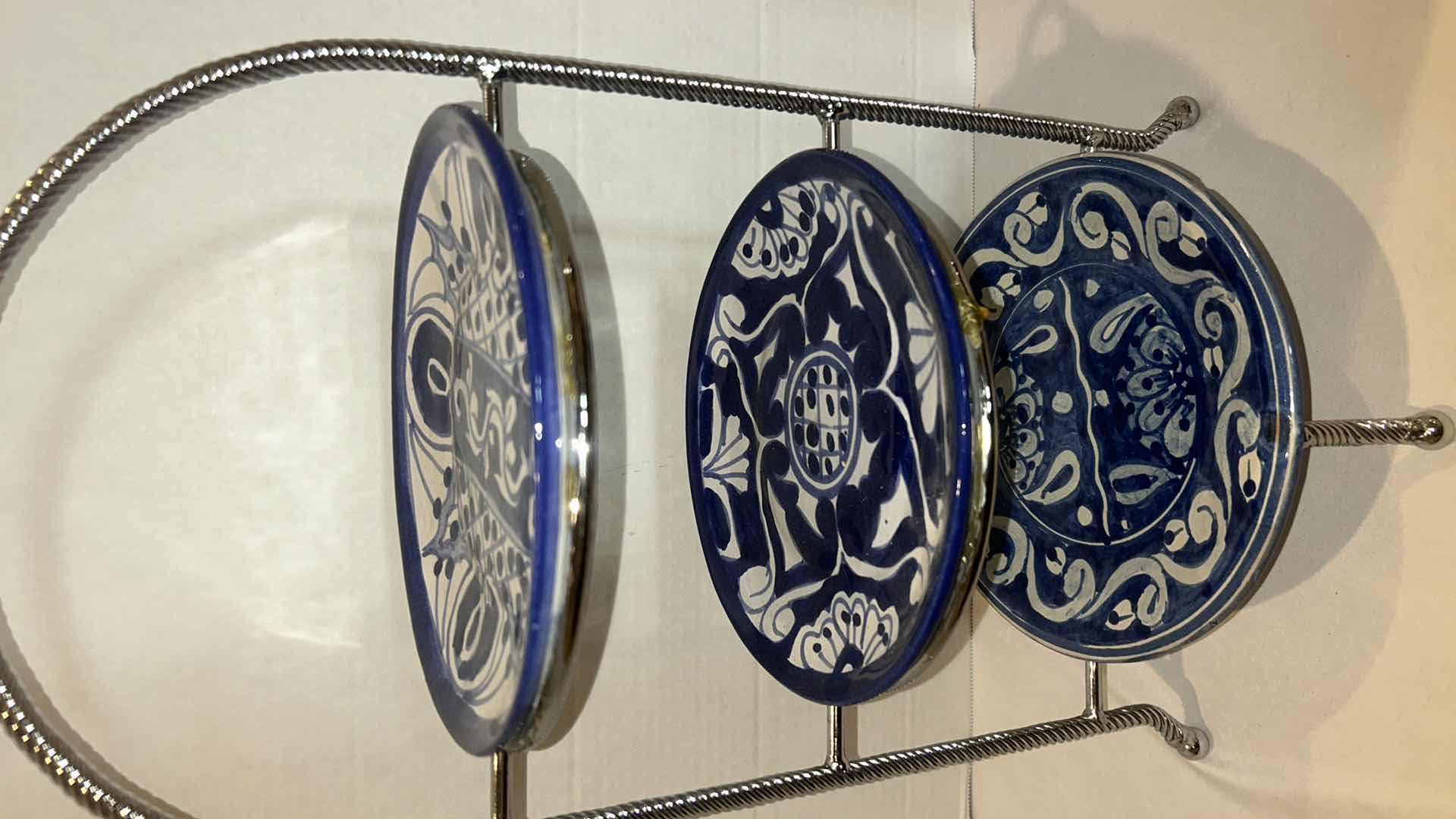 Photo 4 of THREE-TIERED PLATE HOLDER WITH BLUE AND WHITE STONEWARE PLATES FROM MEXICO. H 19”