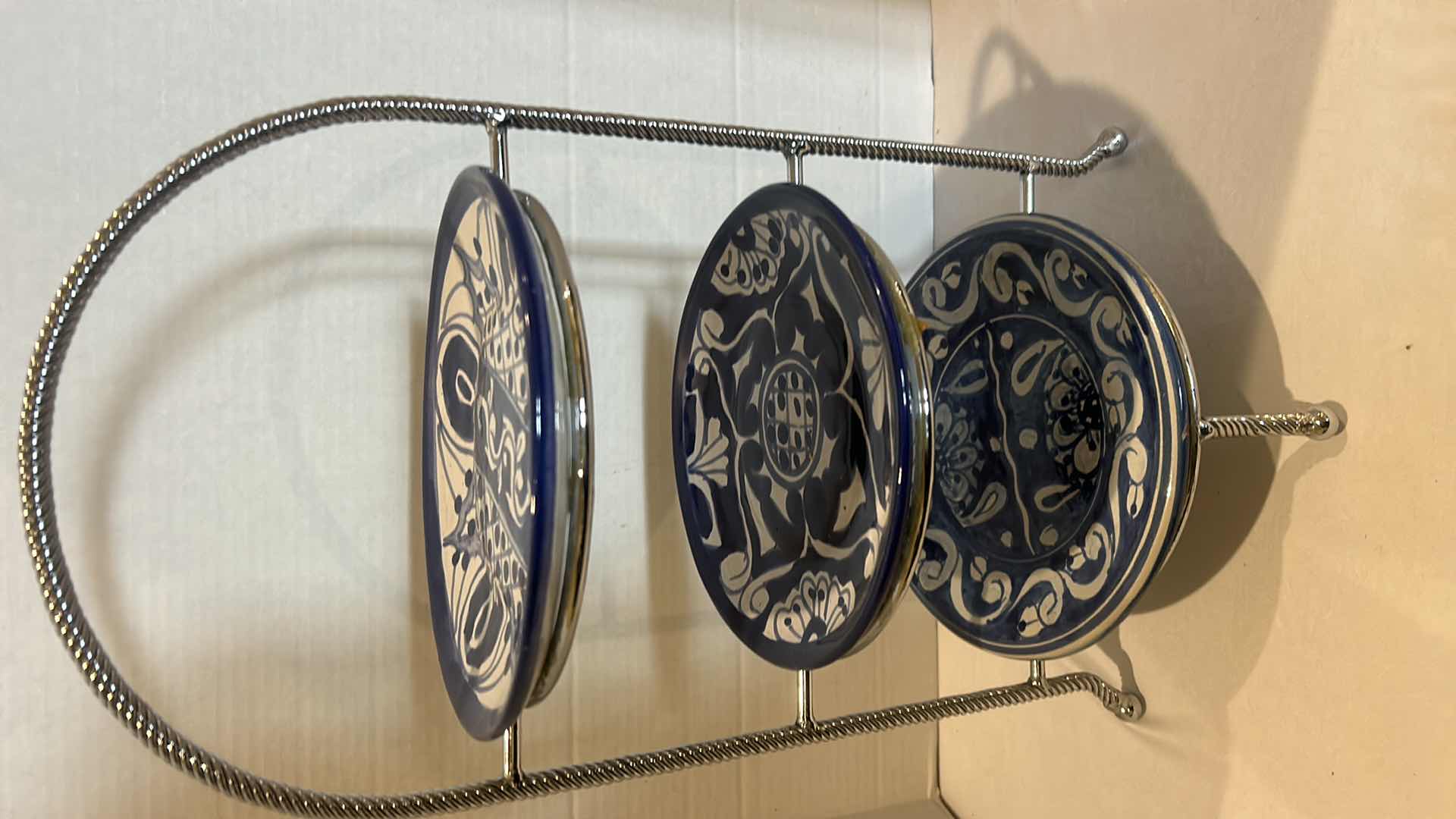 Photo 1 of THREE-TIERED PLATE HOLDER WITH BLUE AND WHITE STONEWARE PLATES FROM MEXICO. H 19”