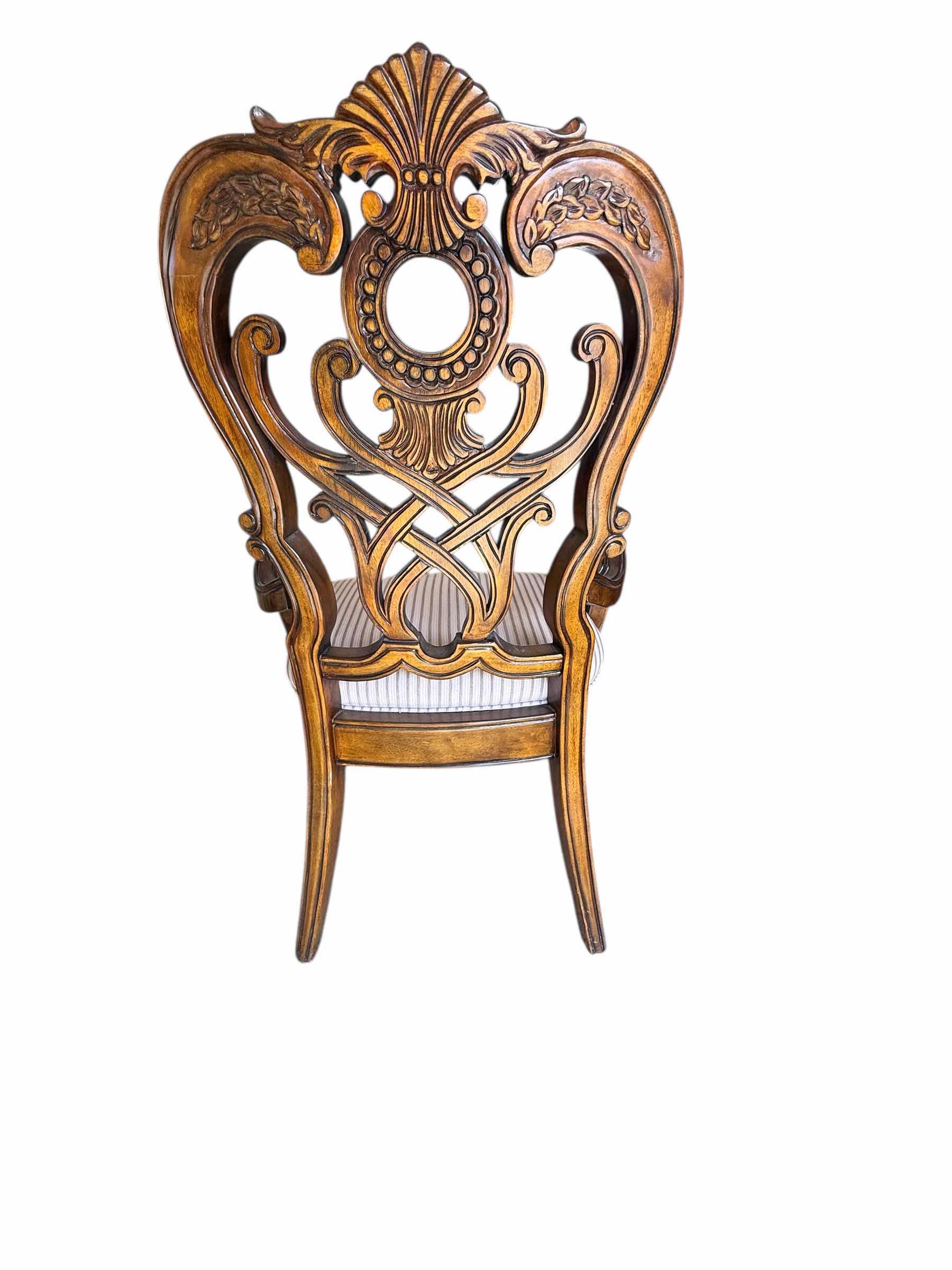 Photo 1 of HEAVY MAHOGANY ORNATE CARVED DINING ARM CHAIR W BEIGE STRIPED UPHOLSTERED SEAT