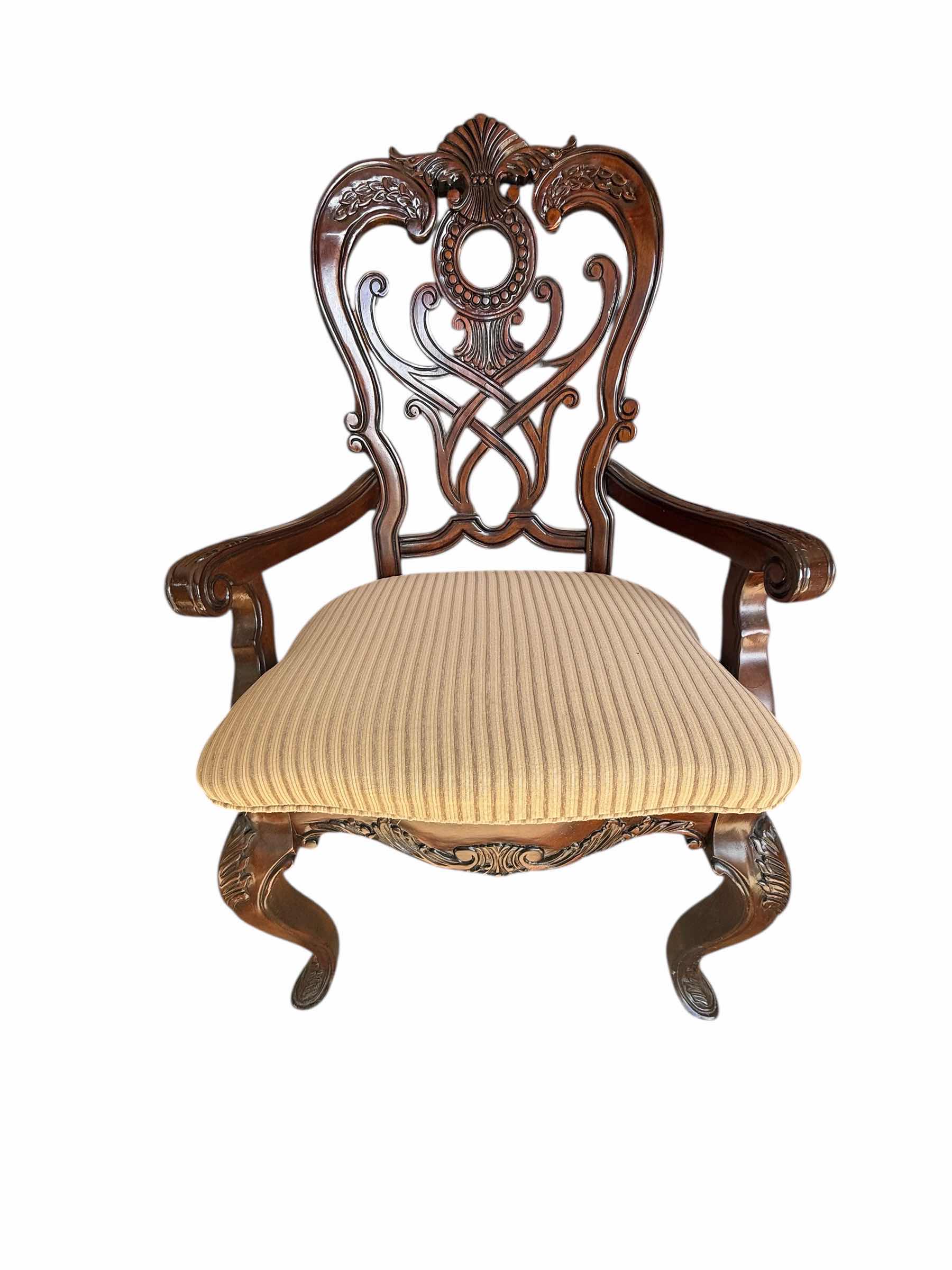 Photo 1 of HEAVY MAHOGANY ORNATE CARVED DINING ARM CHAIR W BEIGE STRIPED UPHOLSTERED SEAT