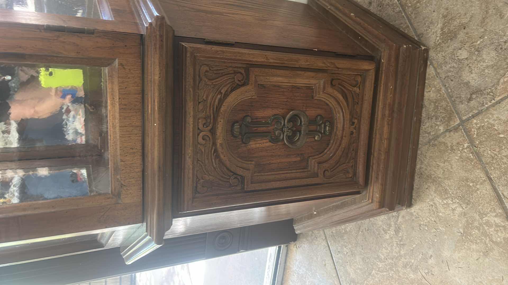 Photo 1 of VINTAGE ILIGHTED WOOD CURIO CABINET WITH WAVY GLASS 25” x 11” x H70”